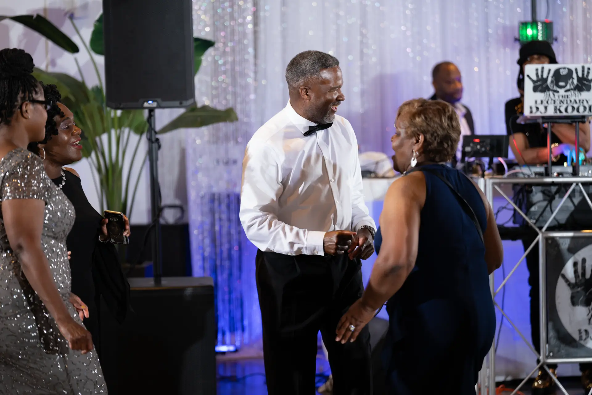 Couple dancing in front of the DJ booth