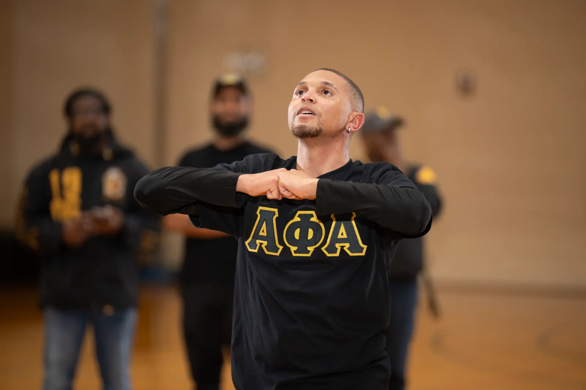 Step team members in black performing in unison
