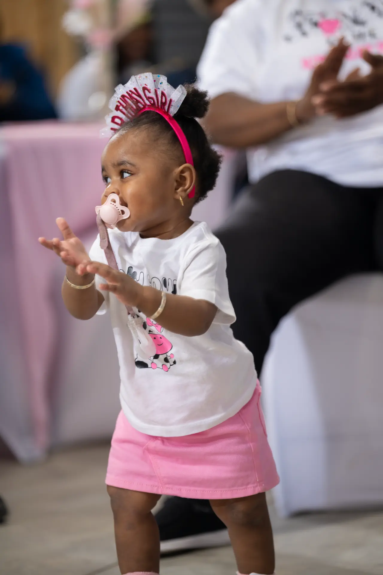 Little girl in a pink tutu at a birthday party