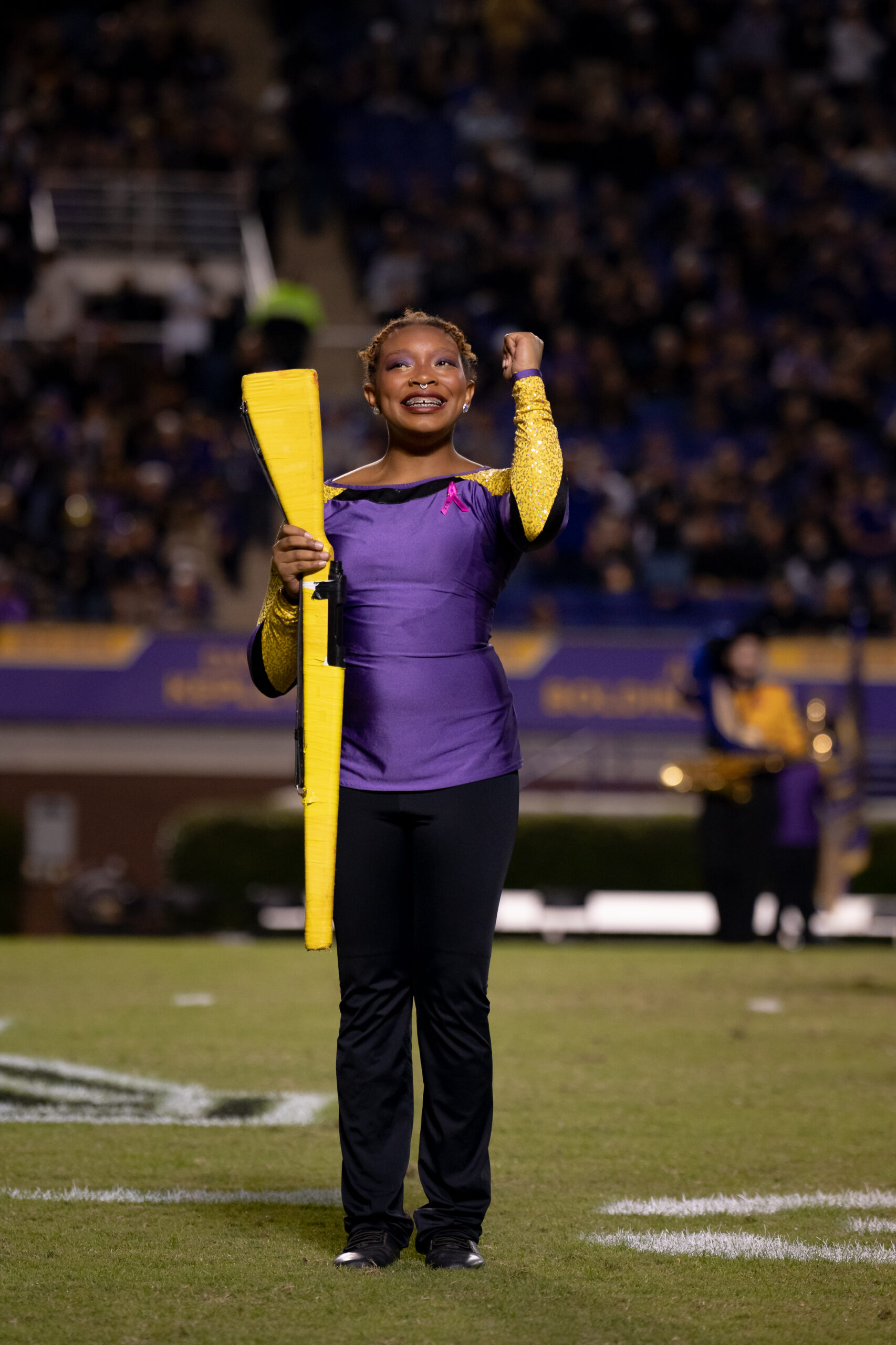 My First ECU College Football Photography Assignment 44 ECU drum major in purple conducting on the field