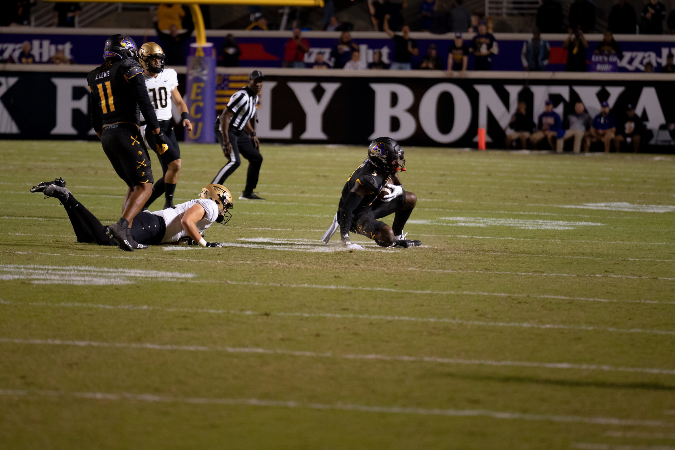 My First ECU College Football Photography Assignment 18 Players piled up after a tackle near the end zone