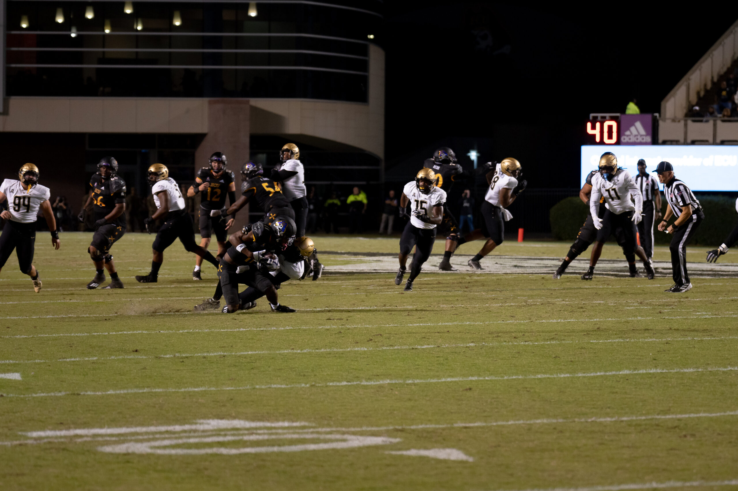 My First ECU College Football Photography Assignment 272 Players in motion at midfield during a night play