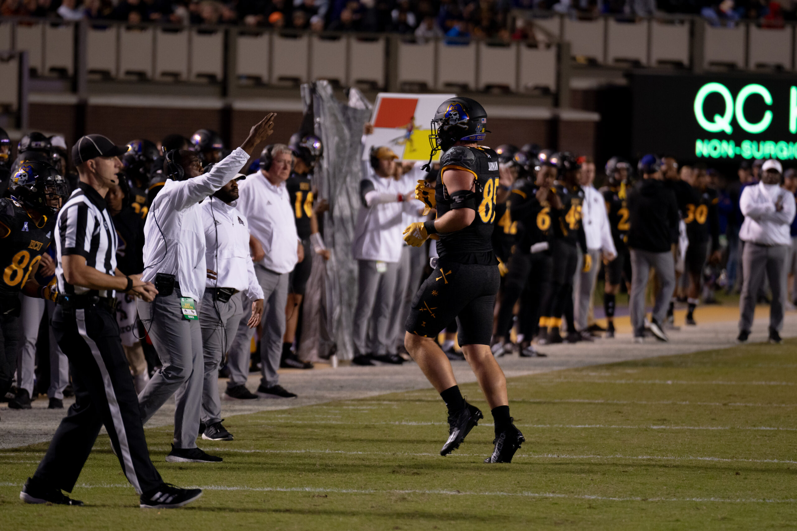My First ECU College Football Photography Assignment 23 Referee and players on the sideline during the ECU vs. UCF game