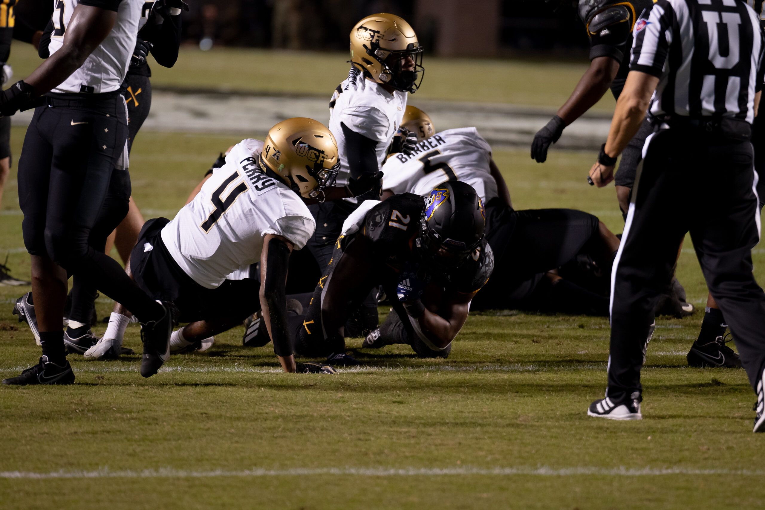 My First ECU College Football Photography Assignment 228 Officials and players sorting out a pile after a tackle