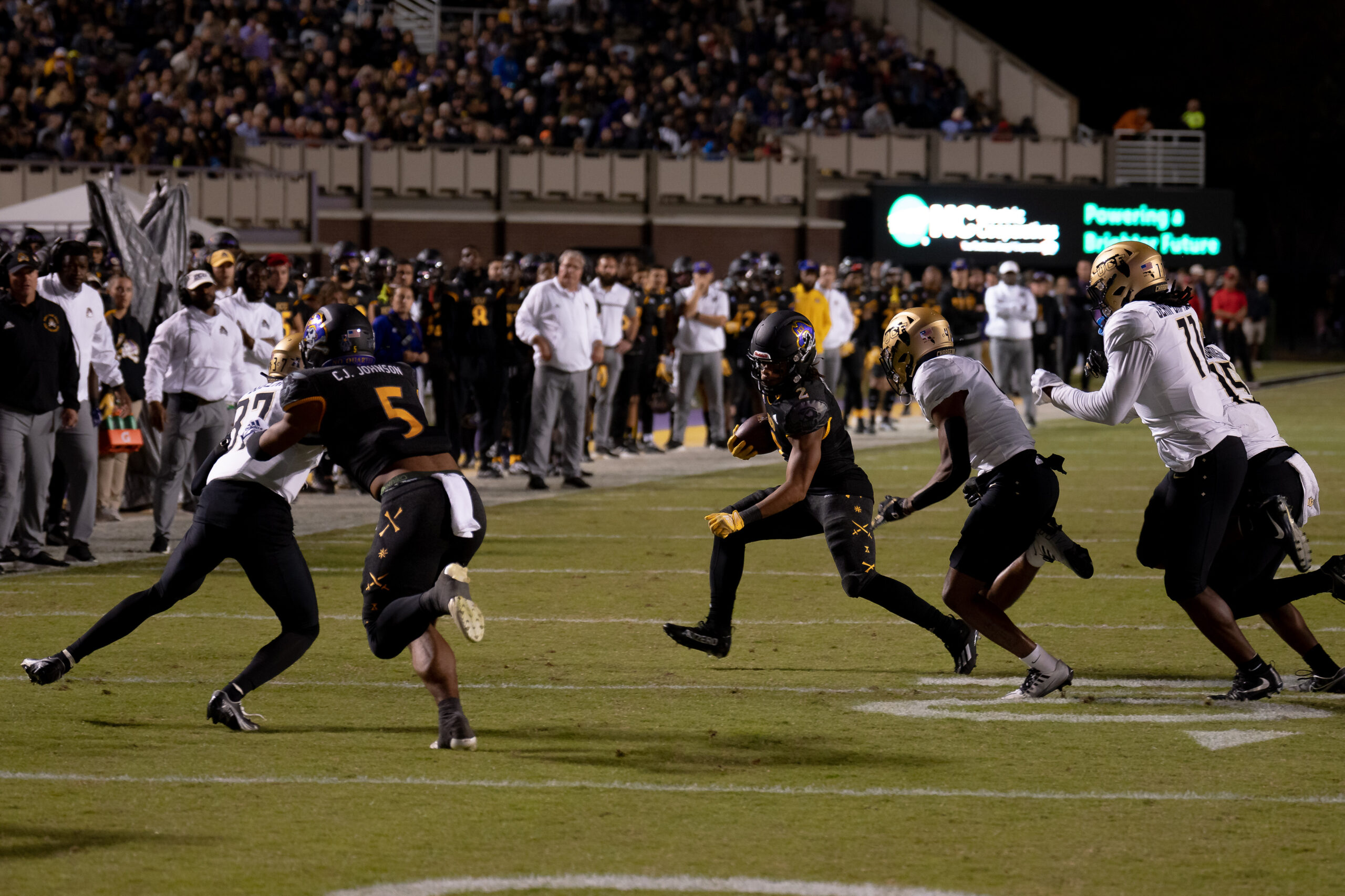 My First ECU College Football Photography Assignment 7 ECU and UCF players colliding at the line of scrimmage