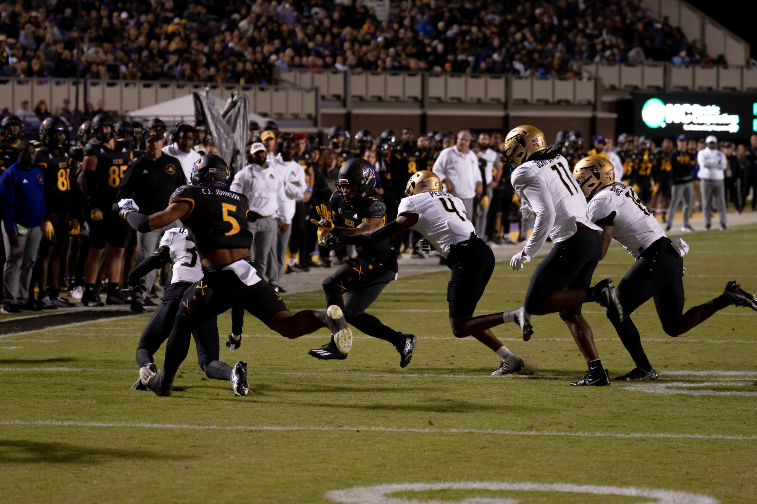 My First ECU College Football Photography Assignment 57 Players scrambling on a kick return