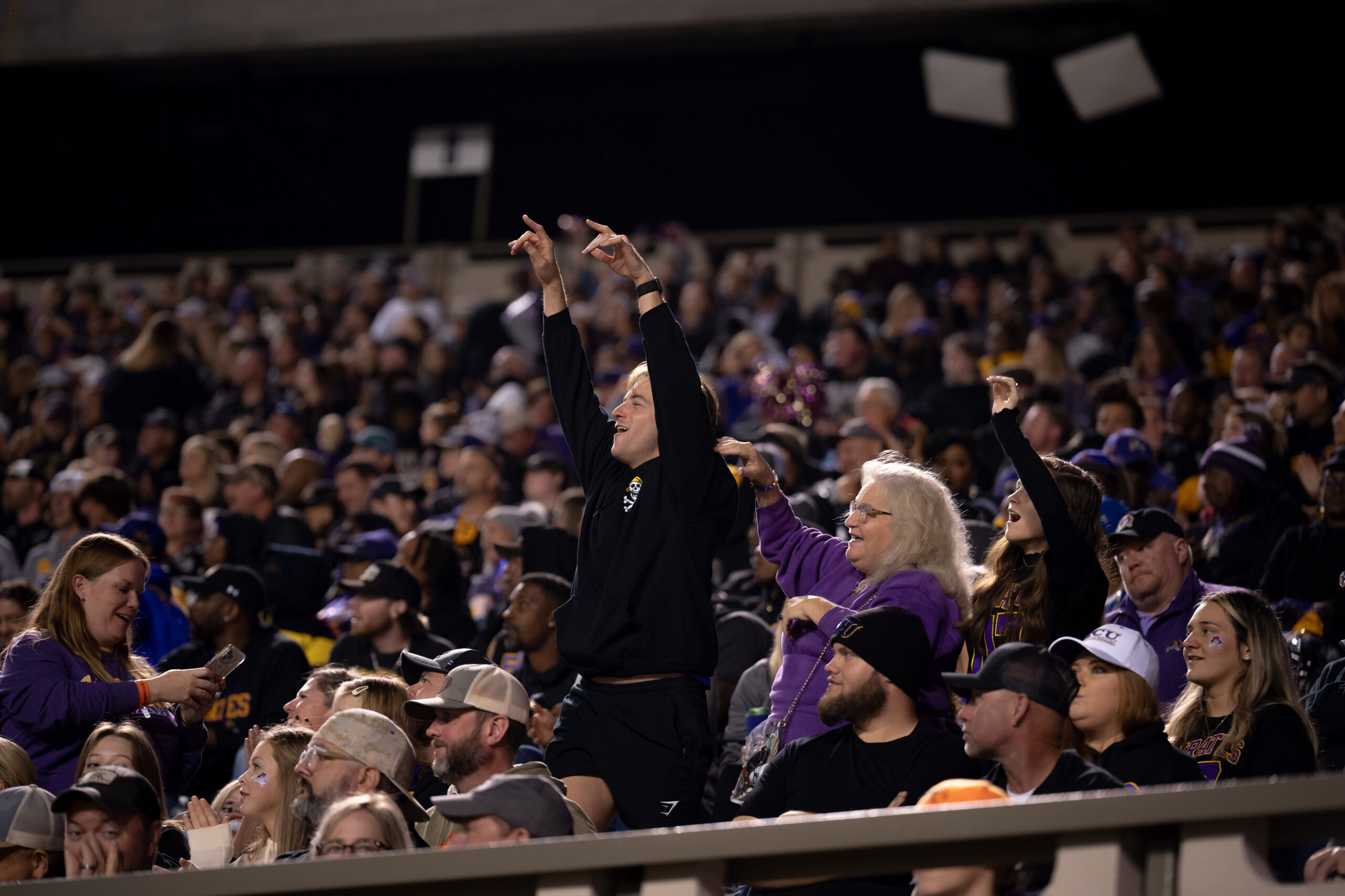 My First ECU College Football Photography Assignment 118 ECU fans cheering in the student section at night