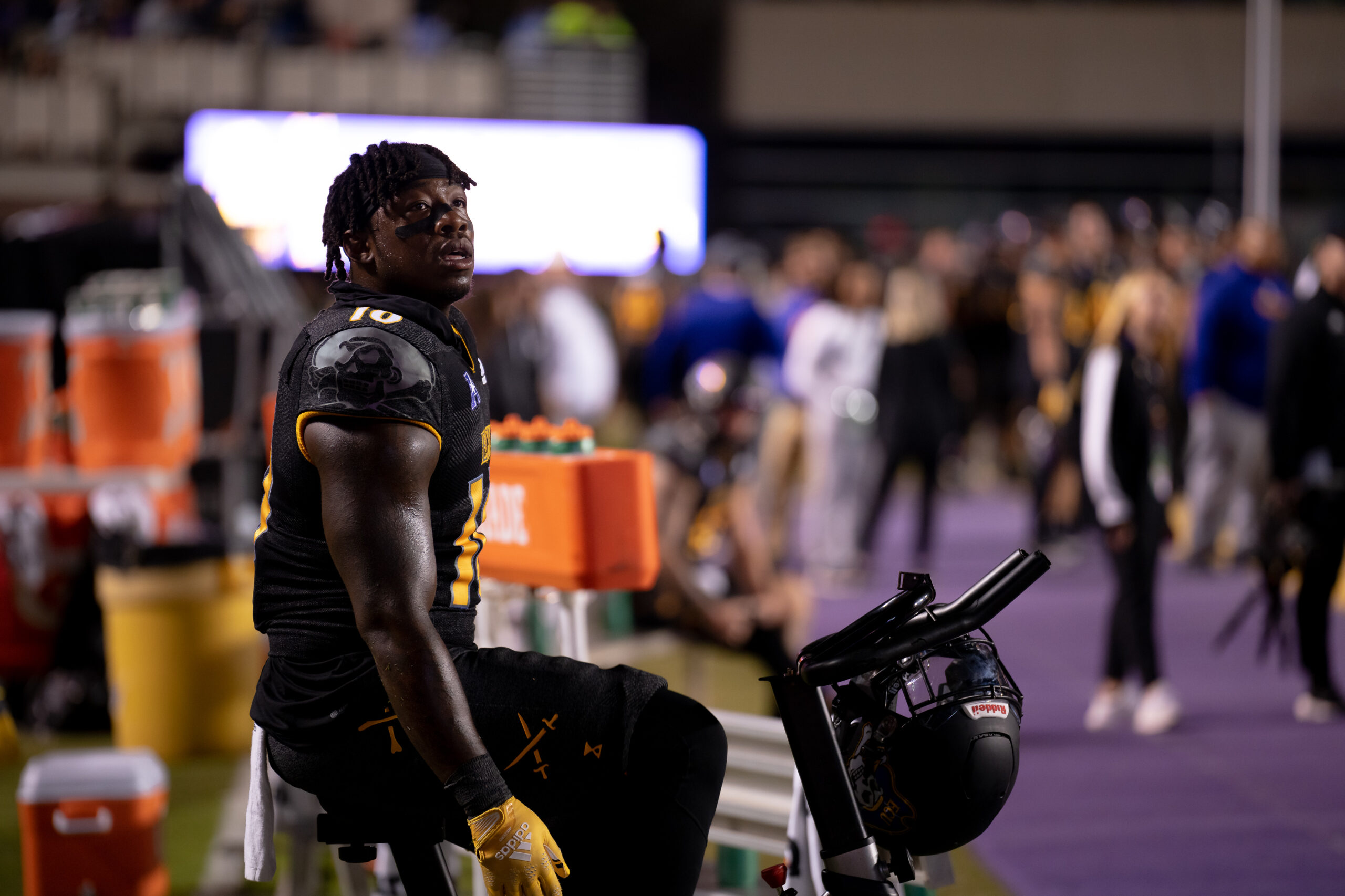 My First ECU College Football Photography Assignment 220 ECU player resting on the bench with a sports drink