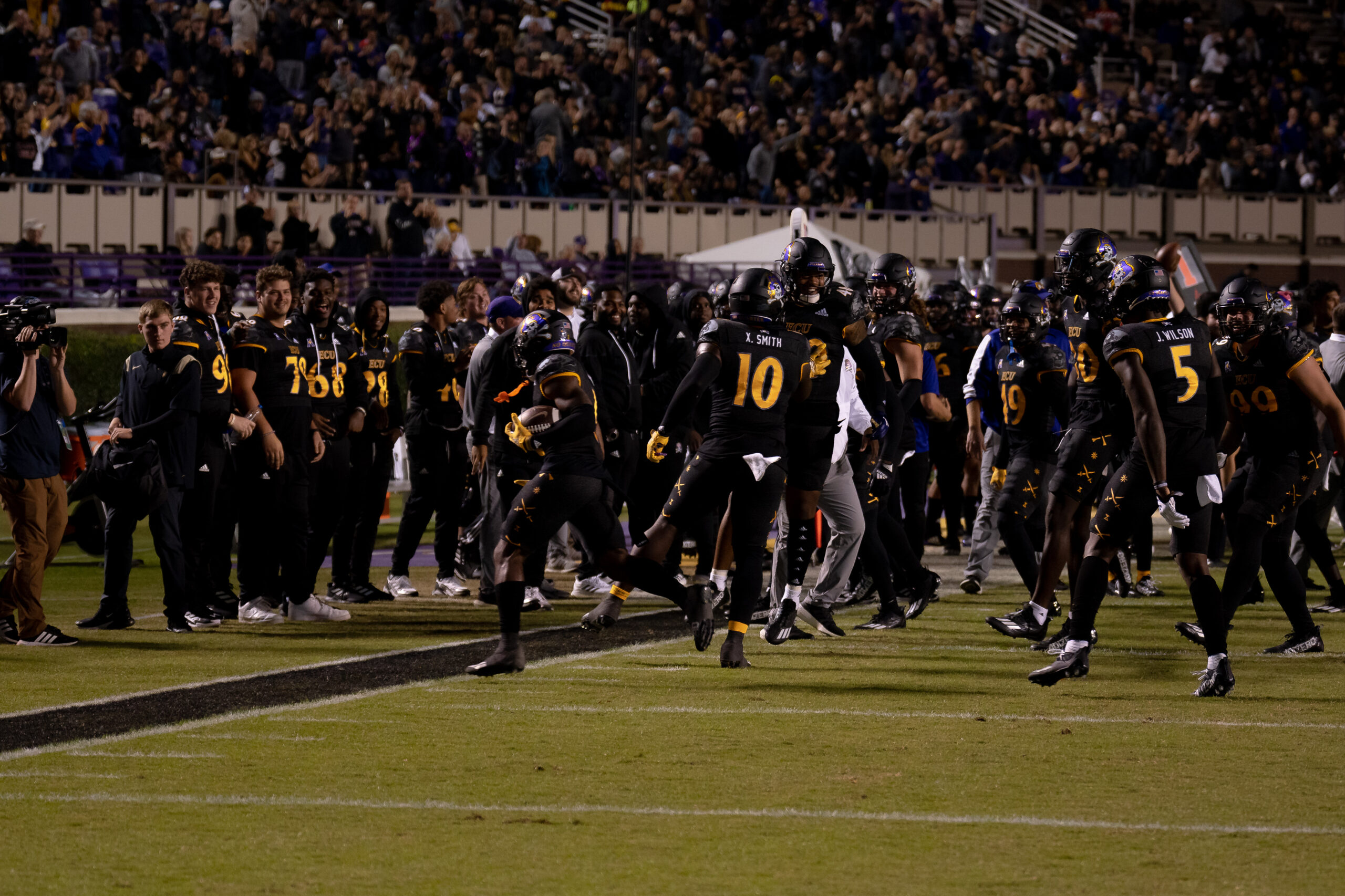My First ECU College Football Photography Assignment 59 ECU team running onto the field