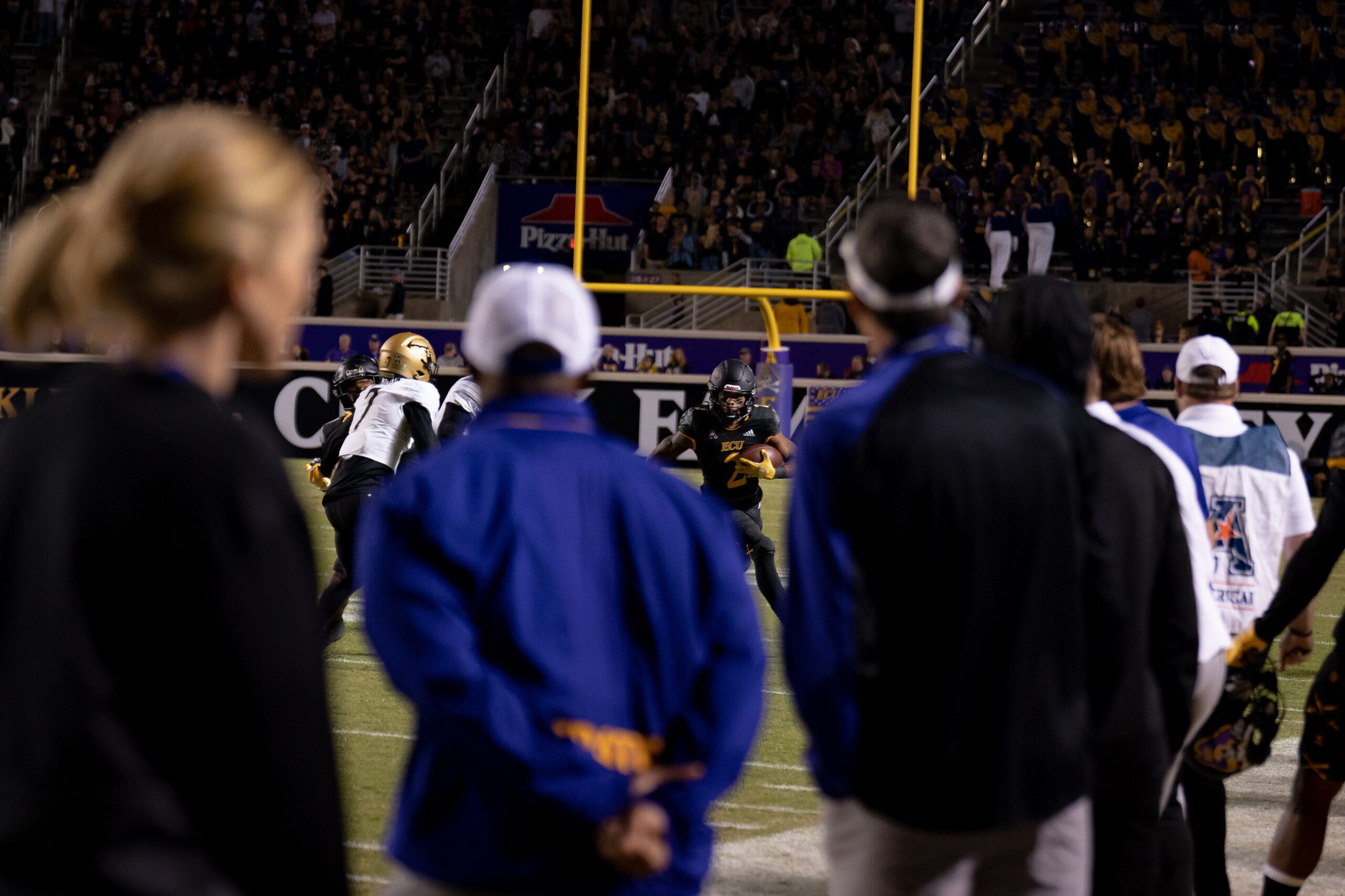 My First ECU College Football Photography Assignment 205 Fans in ECU gear watching from the sideline