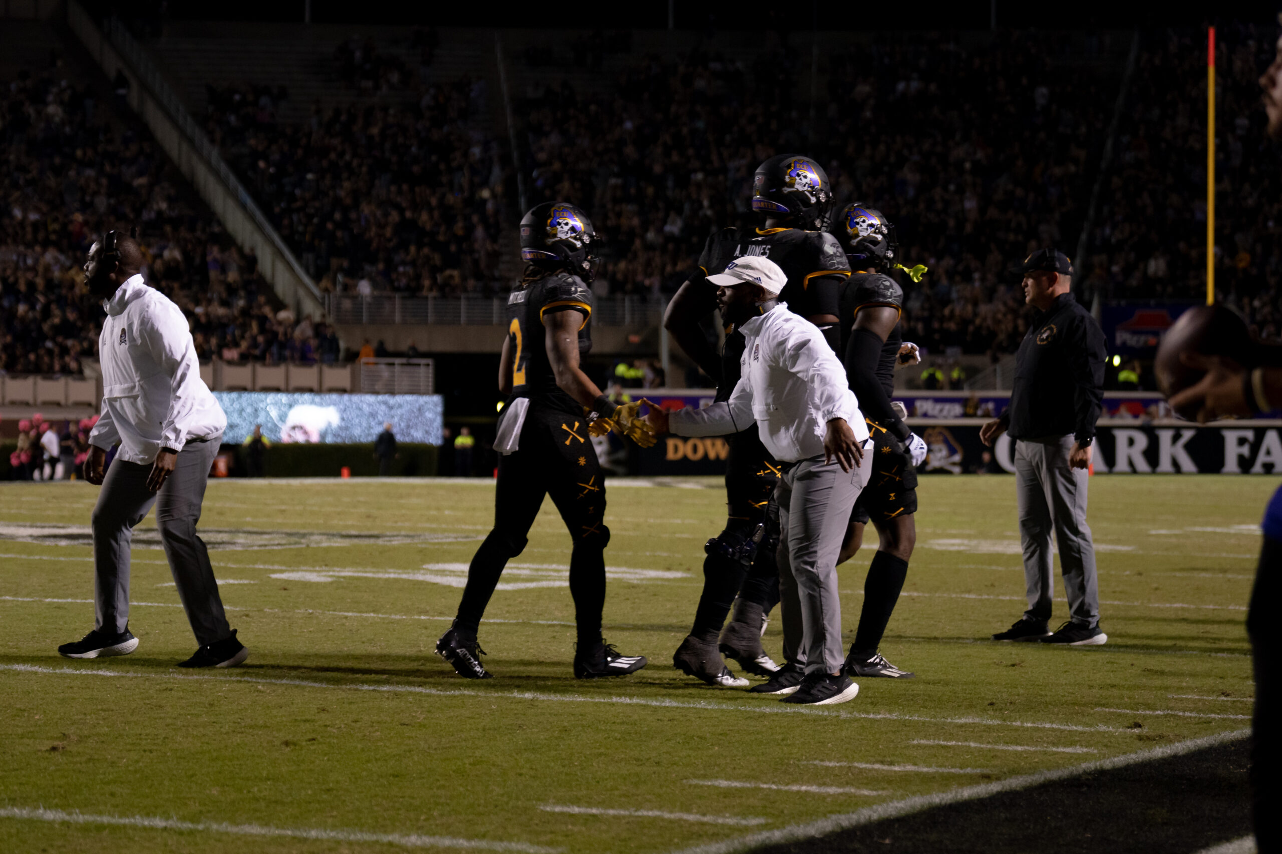 My First ECU College Football Photography Assignment 98 Players and officials walking off the field between plays