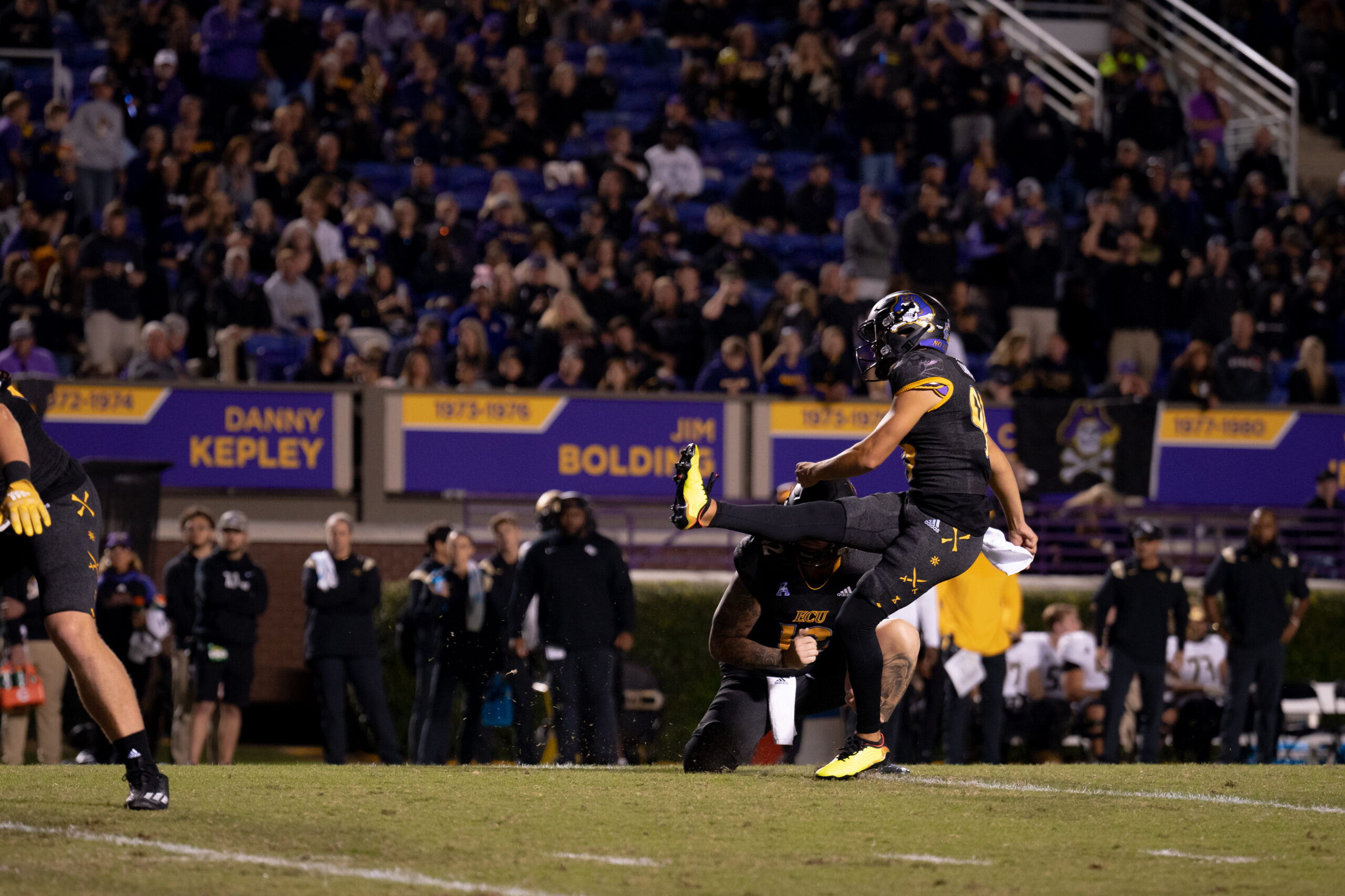 My First ECU College Football Photography Assignment 55 ECU fans and band in the stands behind the sideline