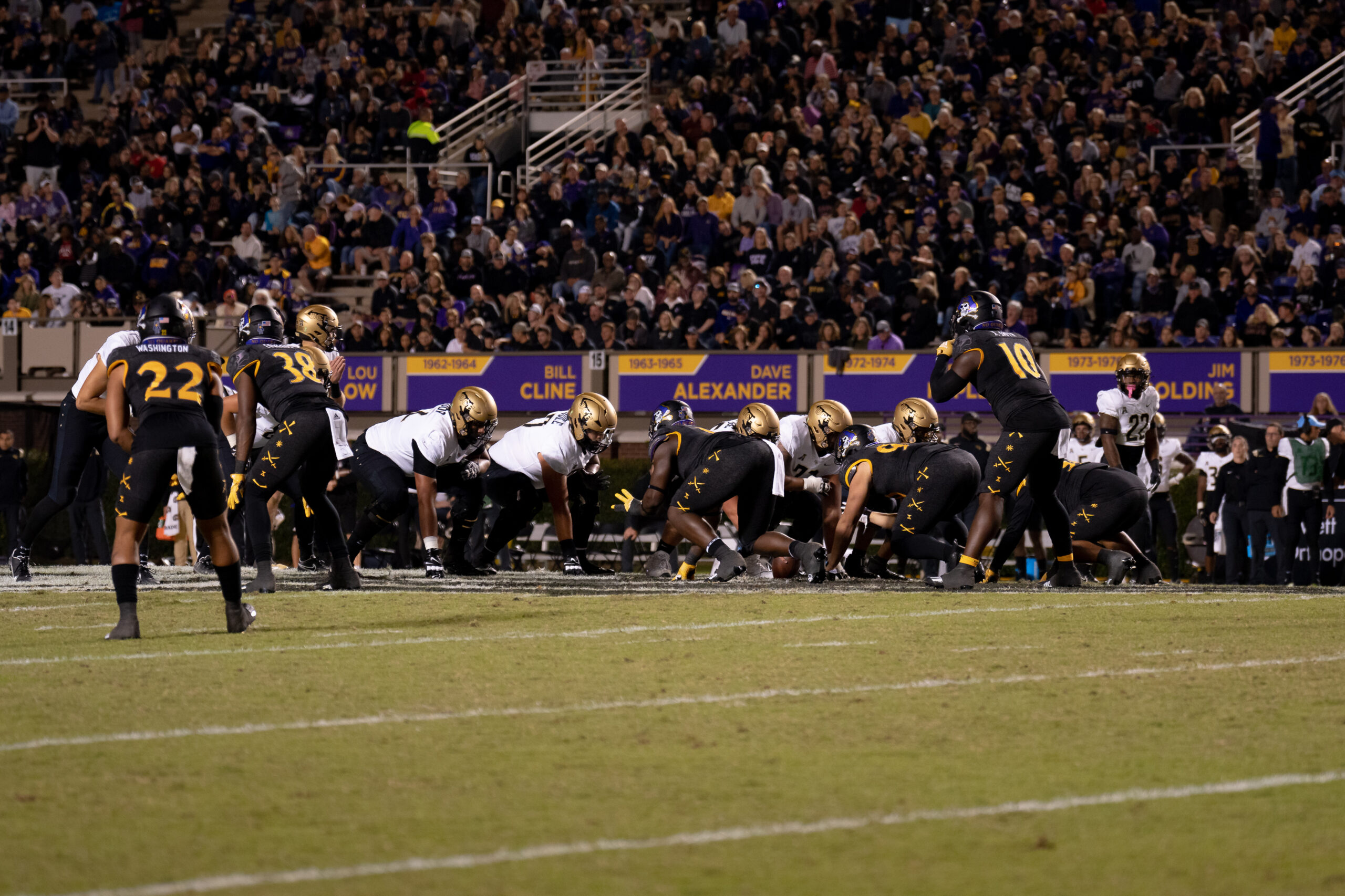 My First ECU College Football Photography Assignment 9 Players lined up at the line of scrimmage in front of a full crowd