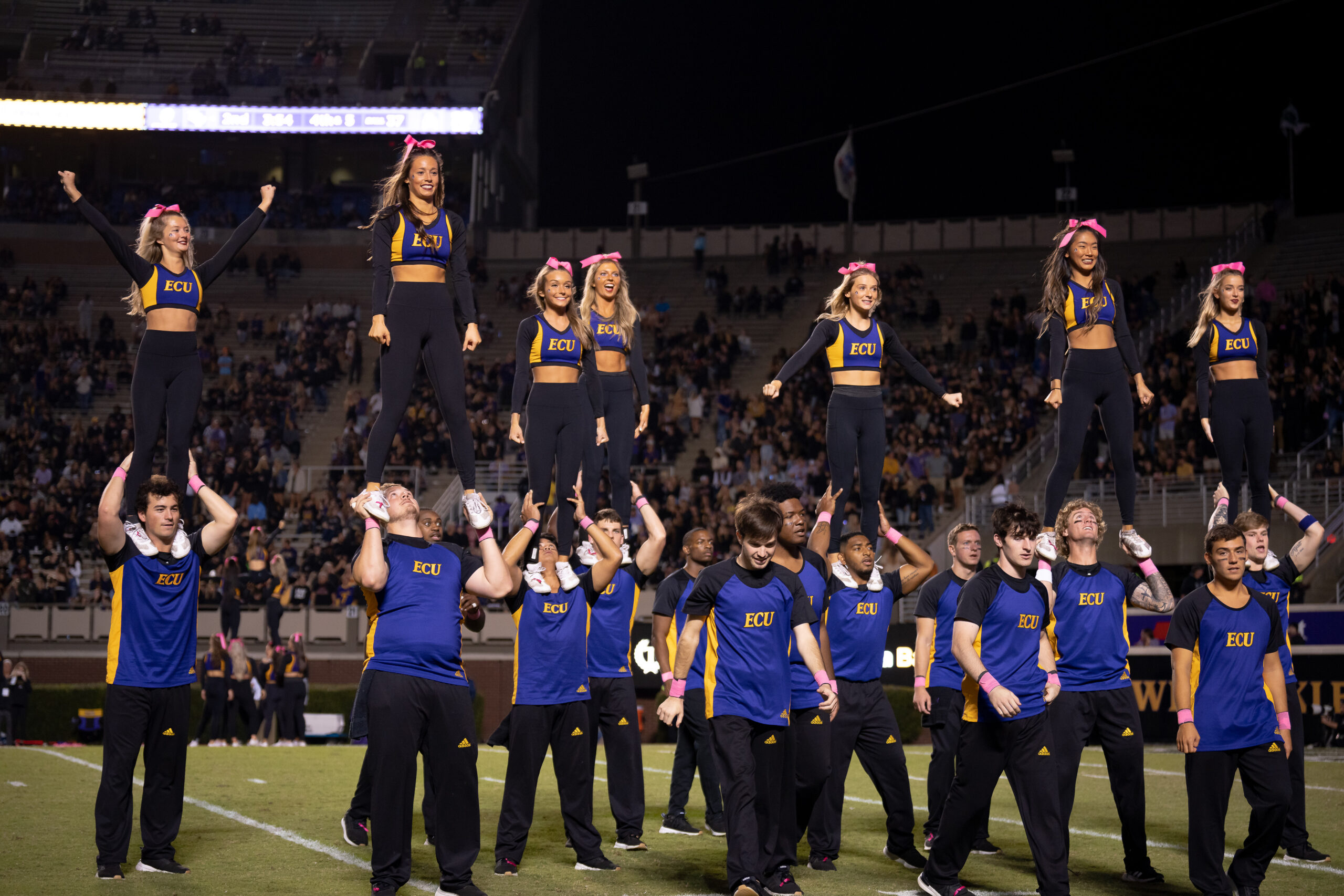 My First ECU College Football Photography Assignment 217 ECU cheerleaders stunting in front of the stands