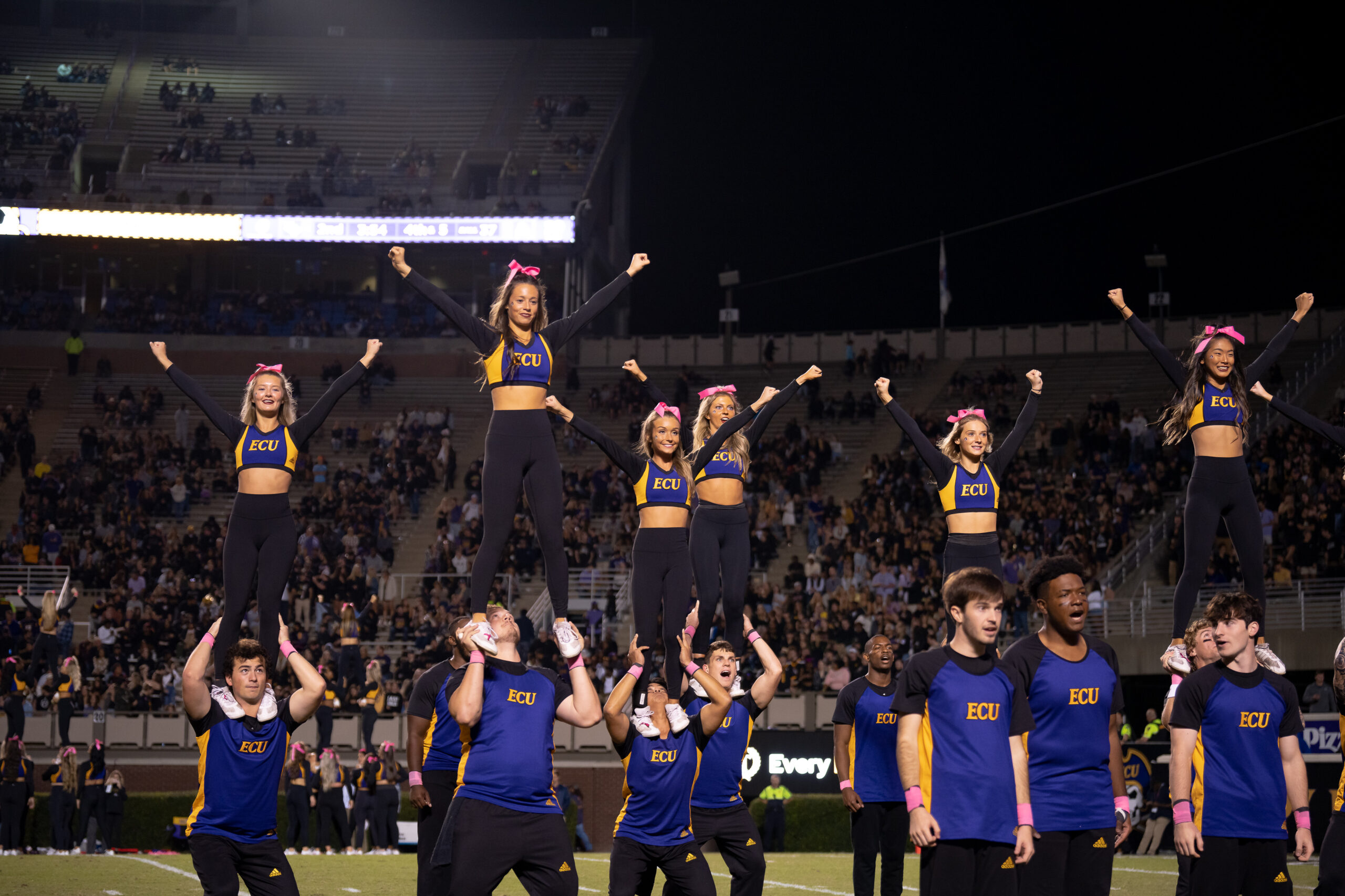 My First ECU College Football Photography Assignment 192 ECU cheerleaders stunting in front of the student section