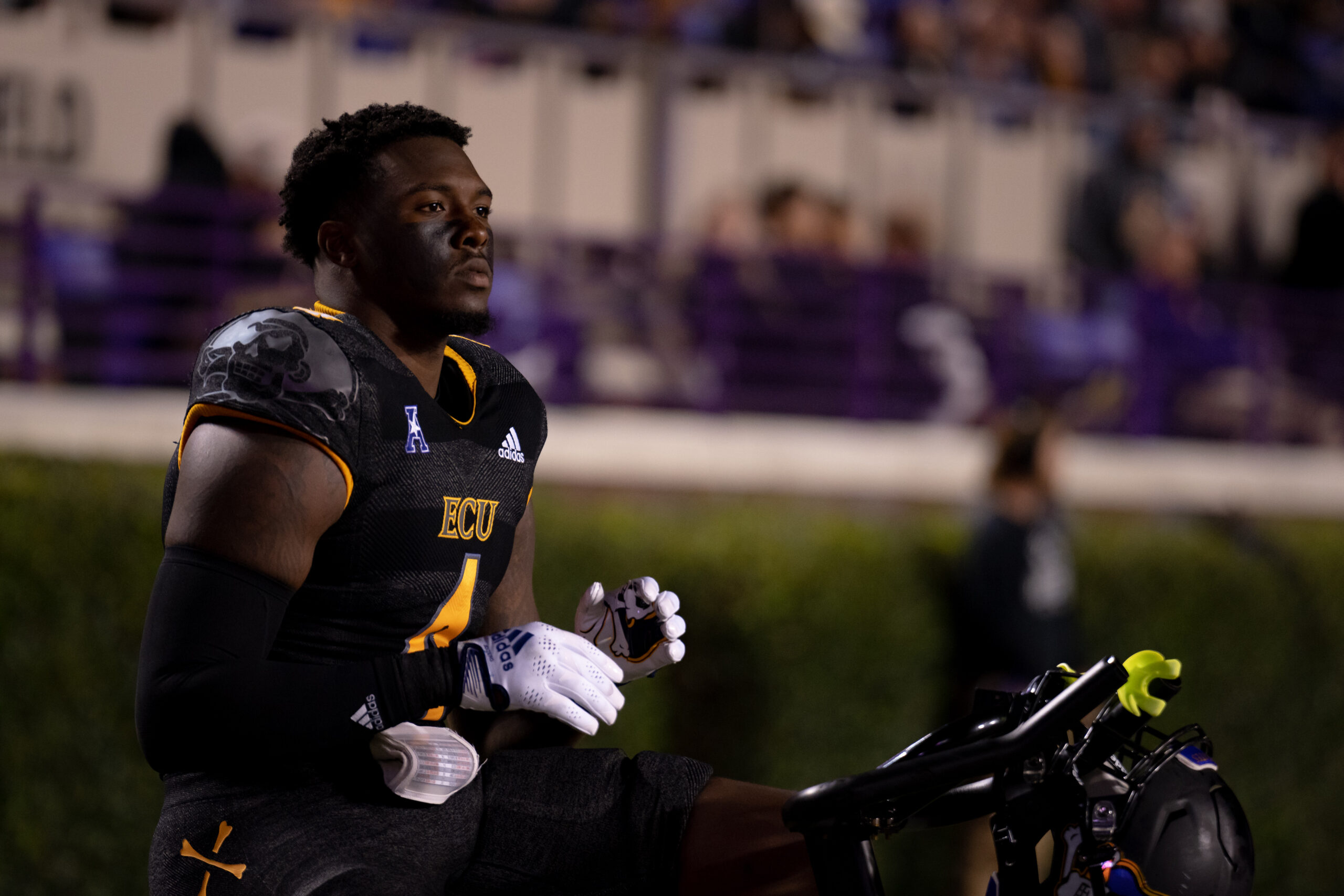My First ECU College Football Photography Assignment 285 ECU player smiling on the sideline with the ball