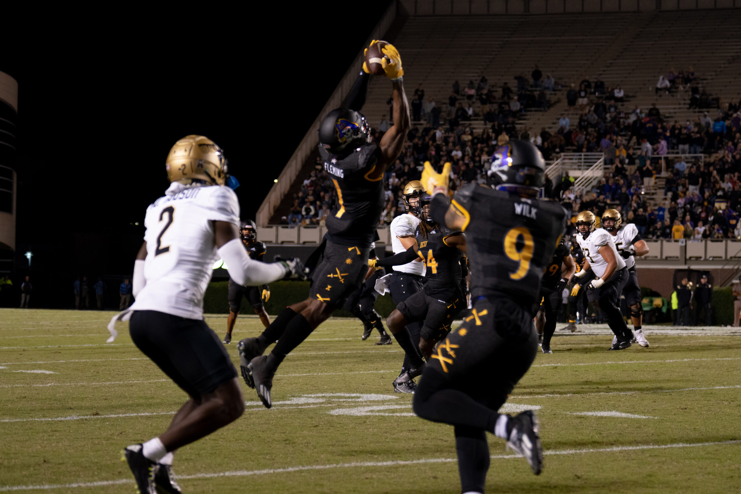 My First ECU College Football Photography Assignment 255 ECU defender leaping to break up a pass