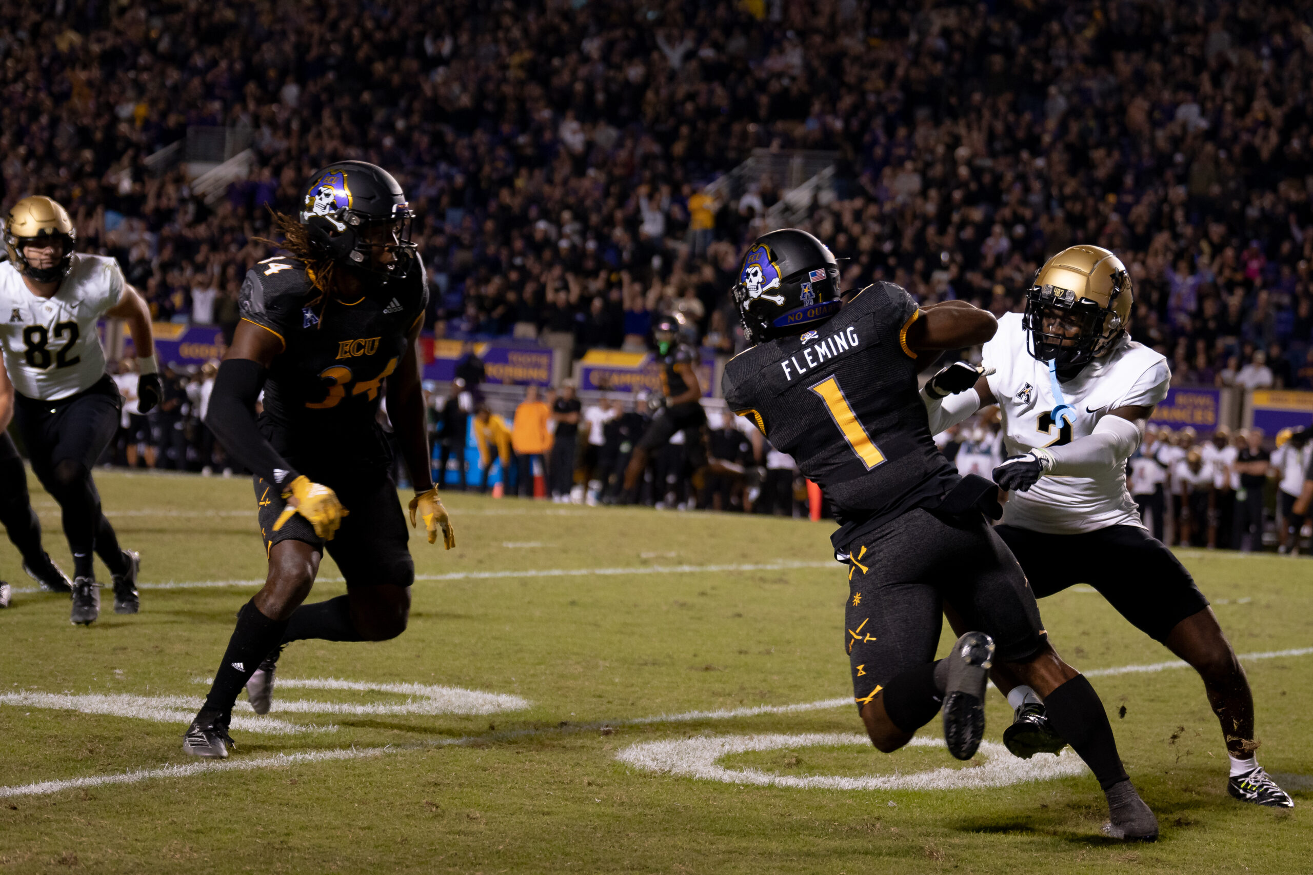 My First ECU College Football Photography Assignment 243 UCF receiver reaching for a pass as an ECU defender closes