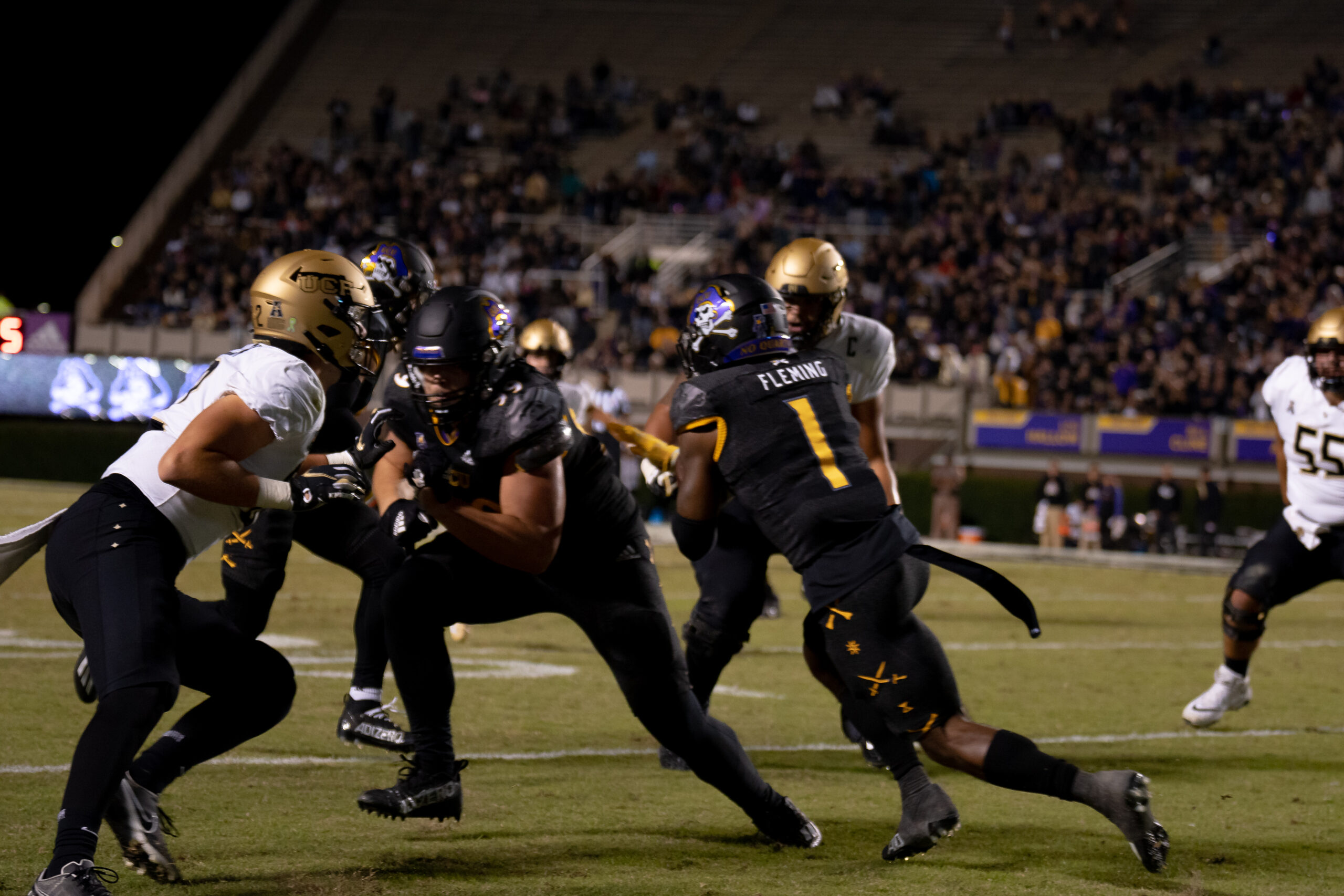 My First ECU College Football Photography Assignment 79 ECU and UCF players fighting for yardage