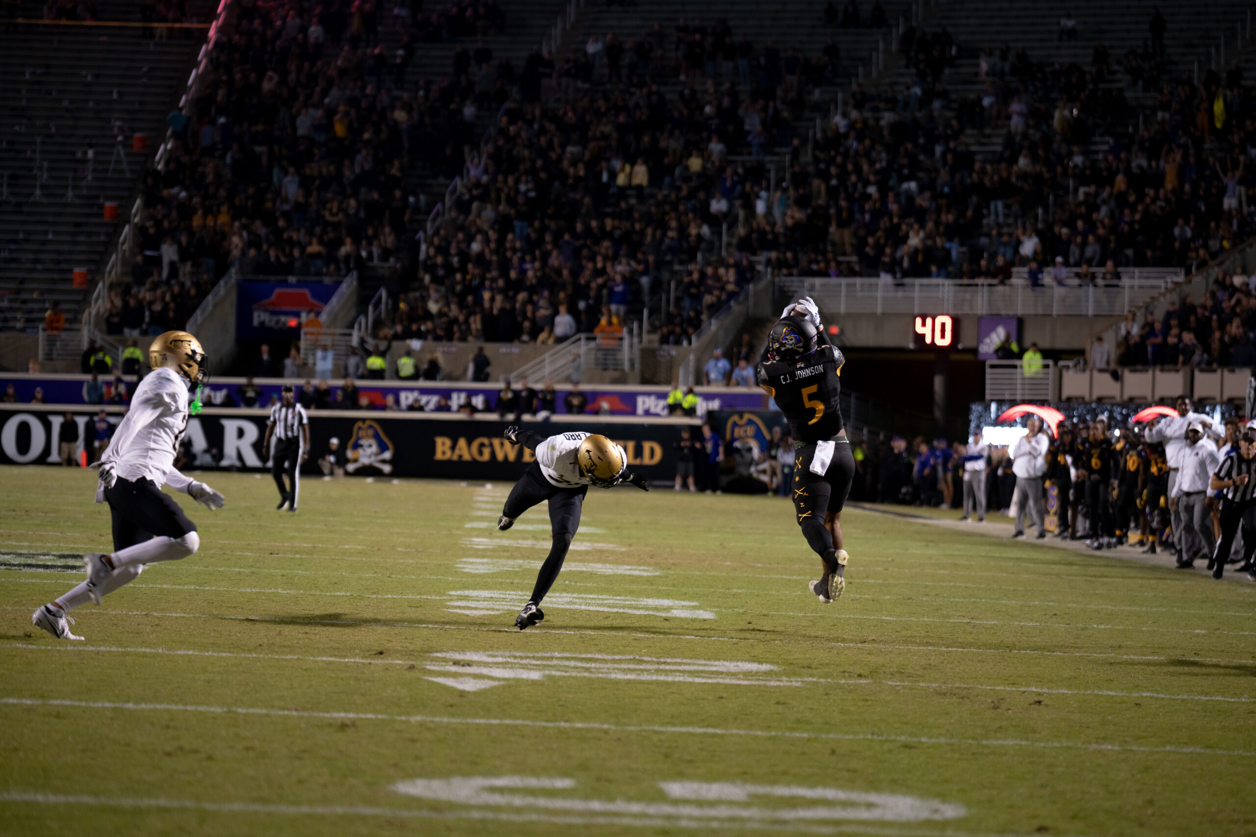 My First ECU College Football Photography Assignment 64 Ball carrier racing down the sideline at night