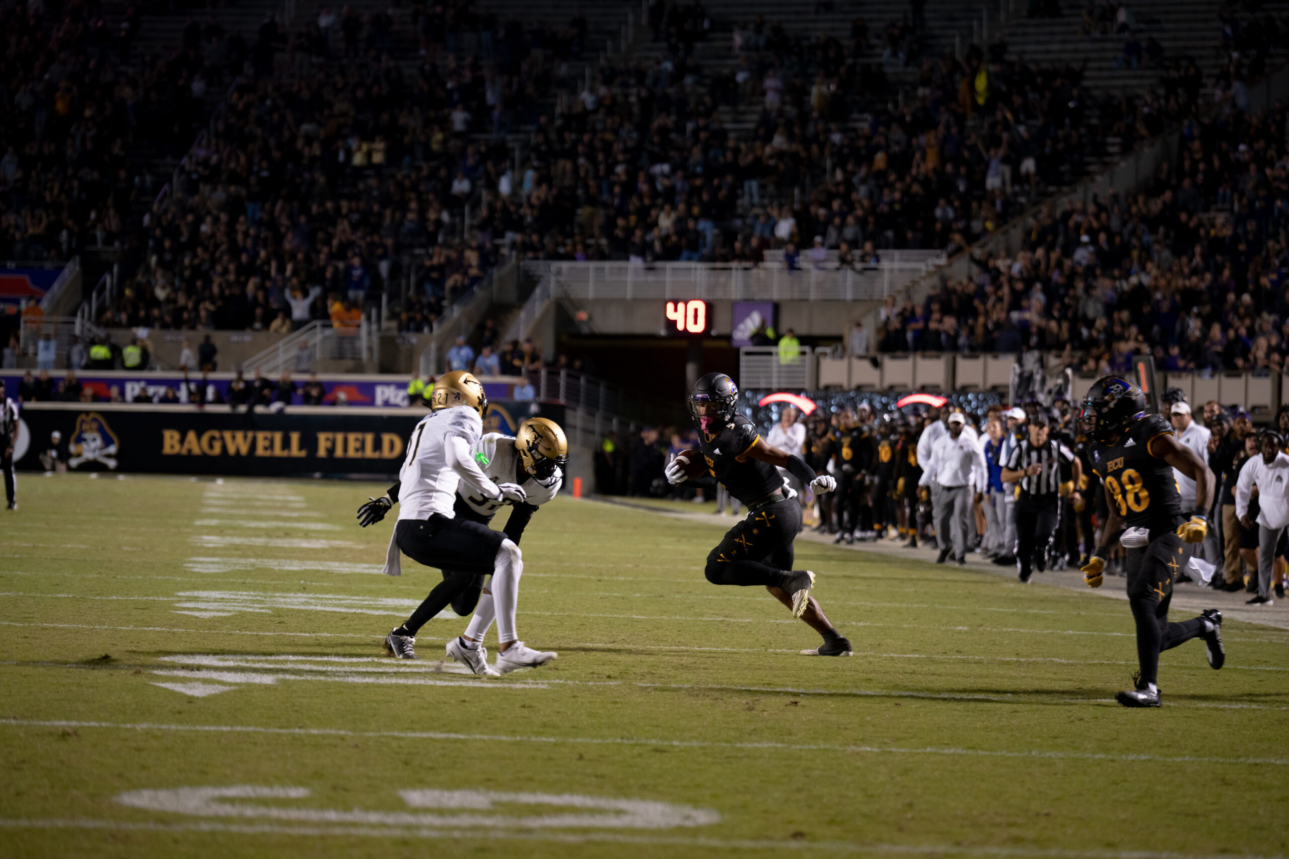 My First ECU College Football Photography Assignment 33 UCF and ECU players in action near the sideline