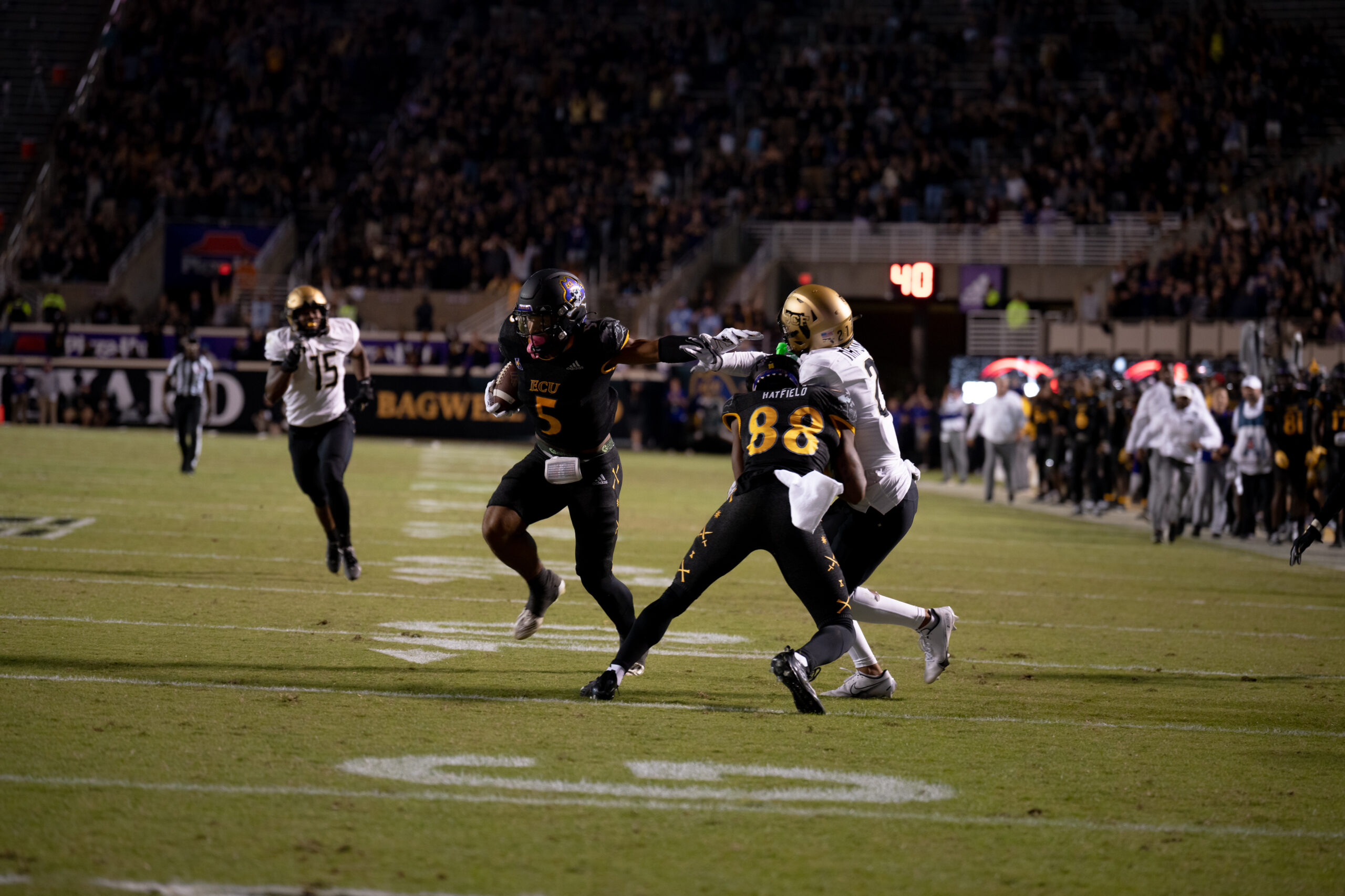 My First ECU College Football Photography Assignment 259 Ball carrier running past defenders