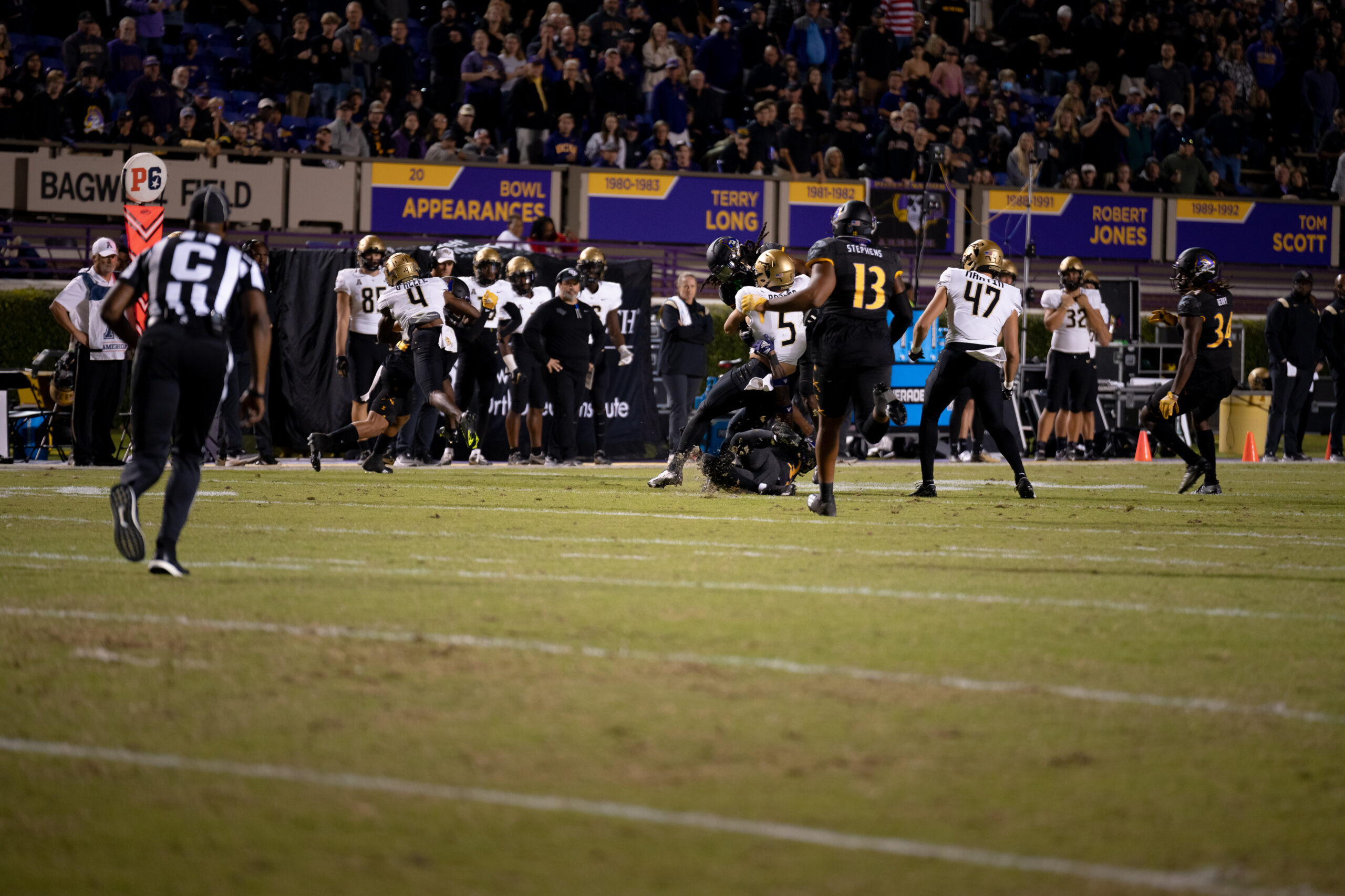 My First ECU College Football Photography Assignment 230 Players lined up on the field in front of the ECU fans