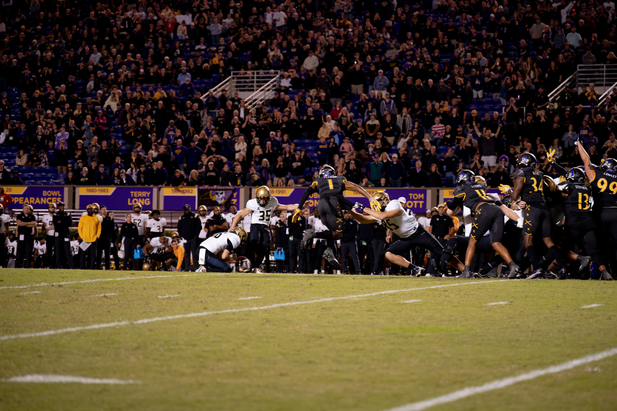 My First ECU College Football Photography Assignment 185 Wide view of a play in progress in front of a full crowd