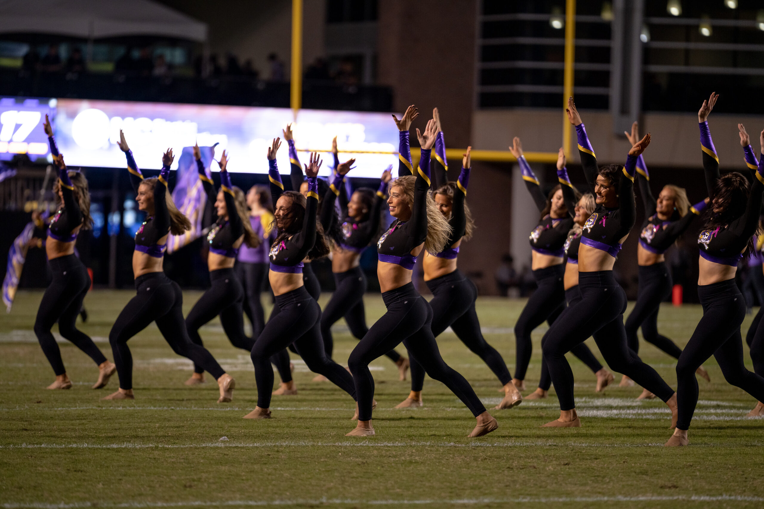 My First ECU College Football Photography Assignment 130 ECU dance team performing in sparkling purple uniforms