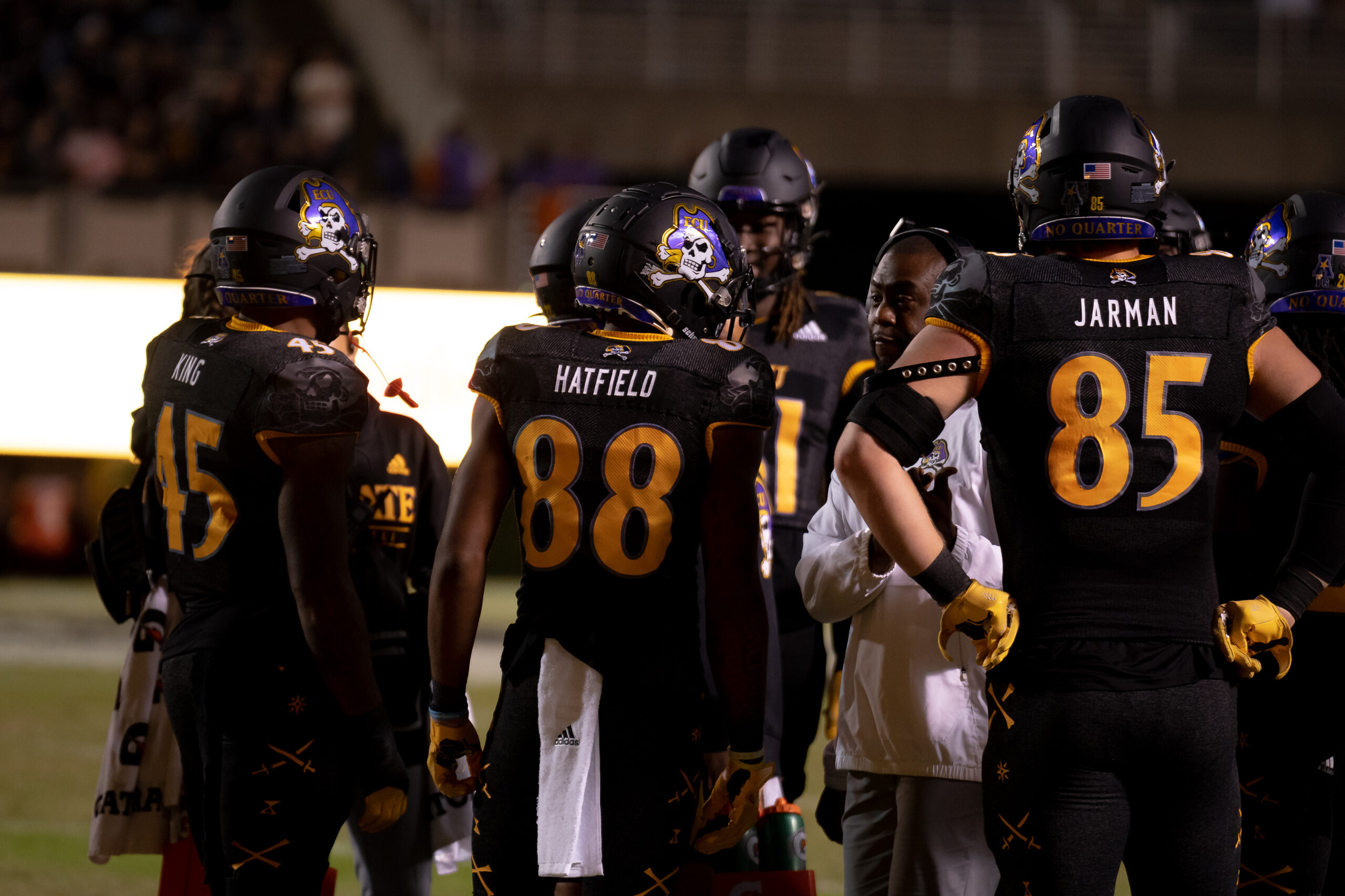 My First ECU College Football Photography Assignment 131 ECU players No. 68 and No. 85 standing on the sideline
