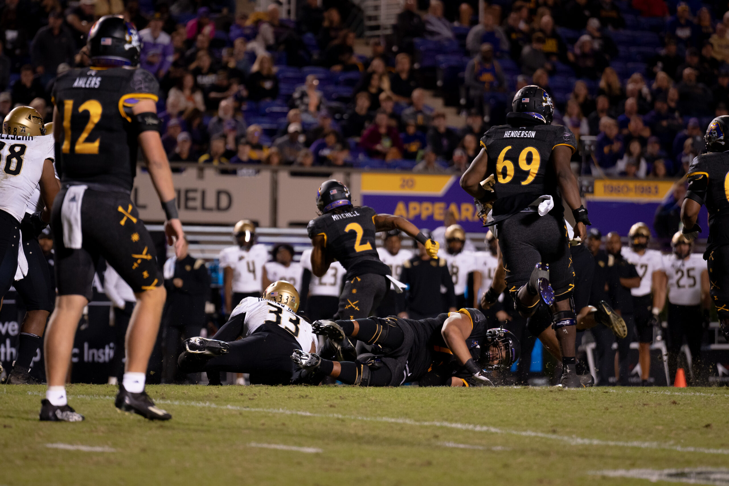 My First ECU College Football Photography Assignment 133 ECU player No. 69 walking the sideline