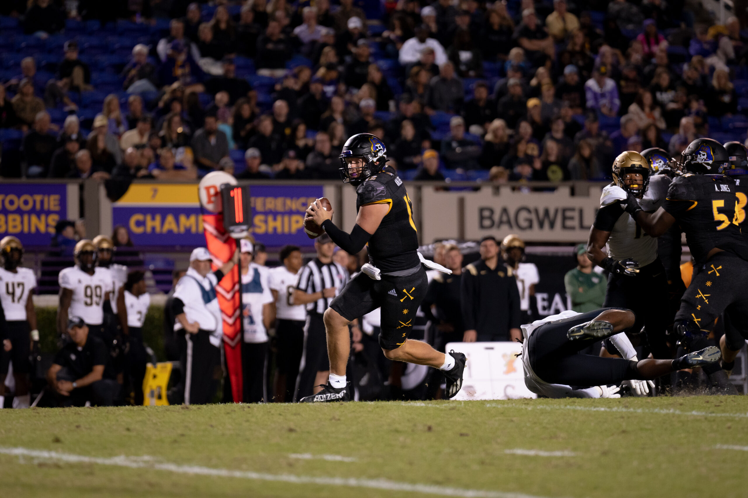 My First ECU College Football Photography Assignment 170 Players spread across the field in front of the stands
