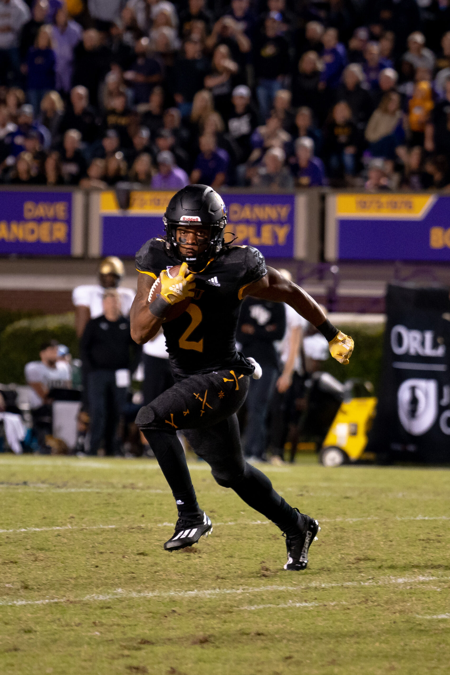 My First ECU College Football Photography Assignment 147 ECU player cutting across the field during a run