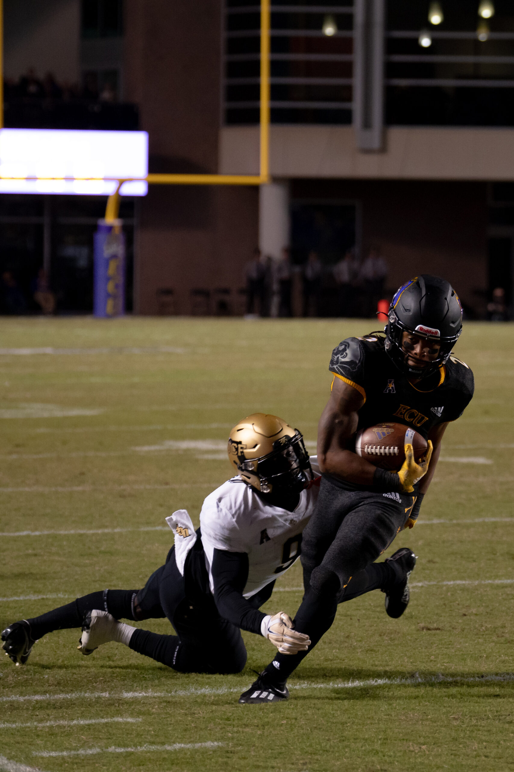 My First ECU College Football Photography Assignment 144 ECU player diving to make a tackle