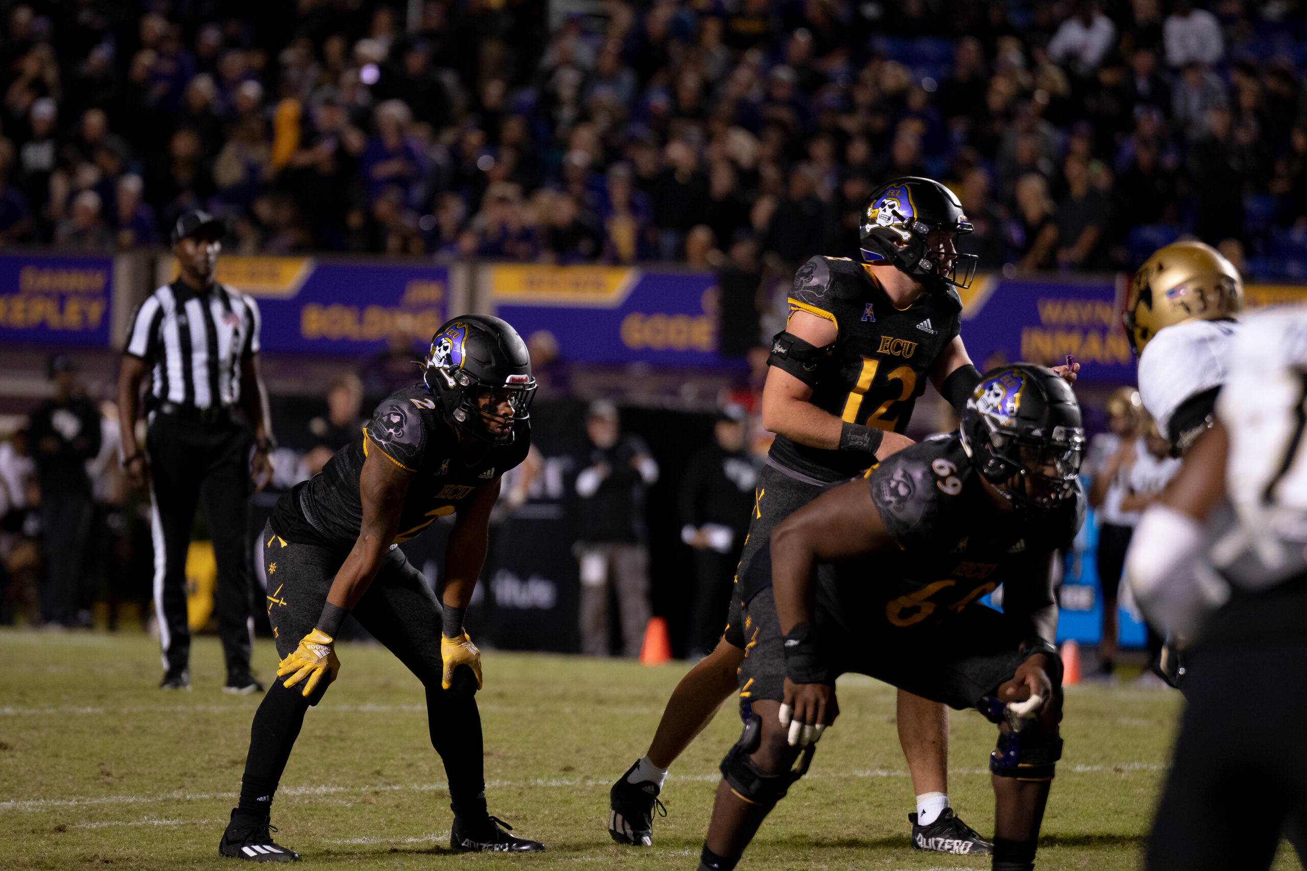 My First ECU College Football Photography Assignment 29 ECU defense swarming a ball carrier in front of the crowd