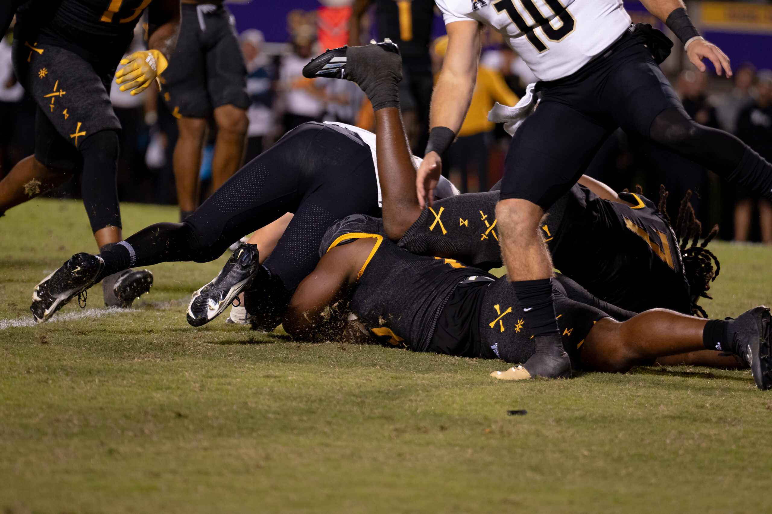 My First ECU College Football Photography Assignment 153 Players piled on the turf after a fumble