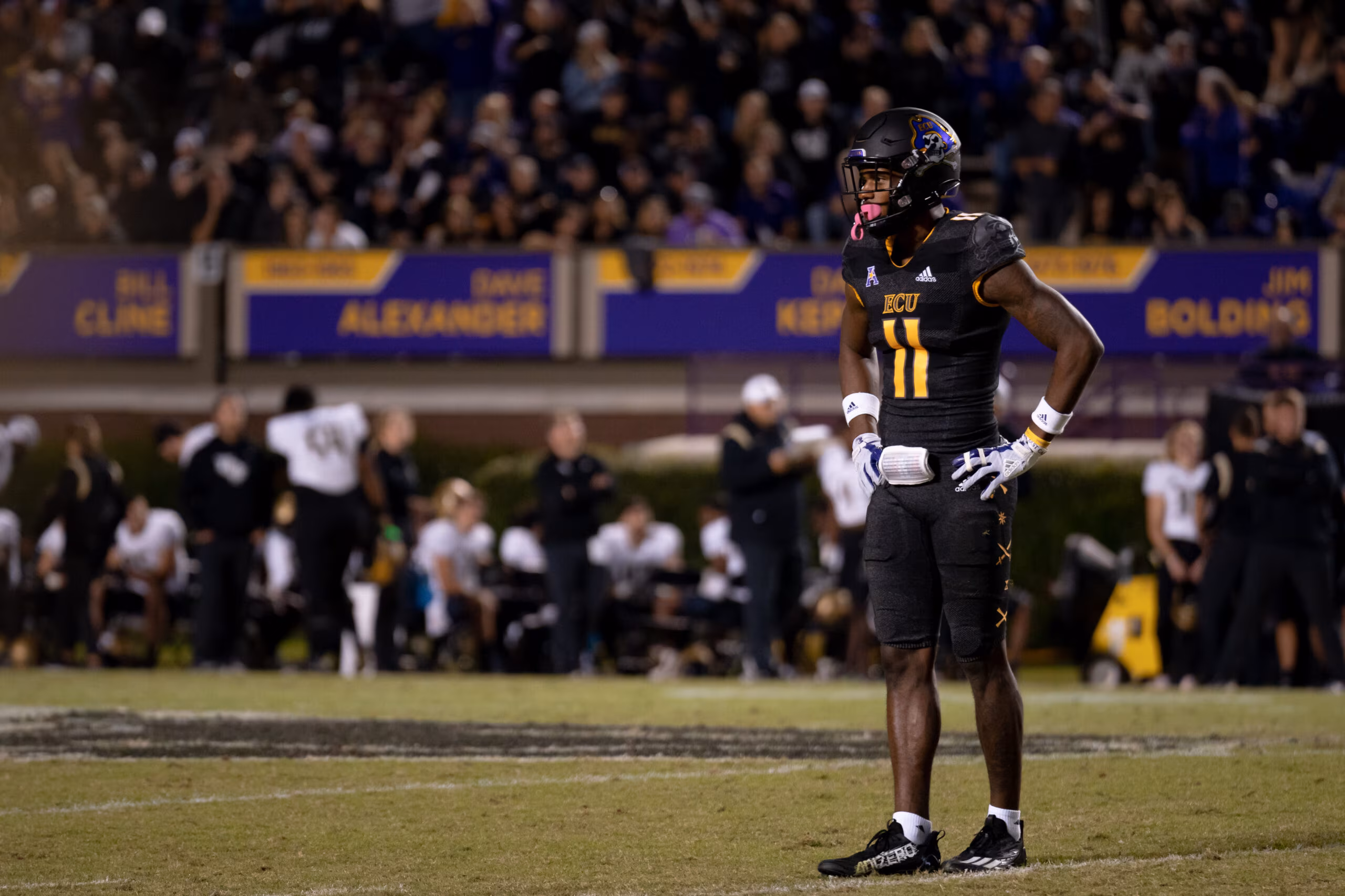 My First ECU College Football Photography Assignment 247 ECU player standing alone on the field