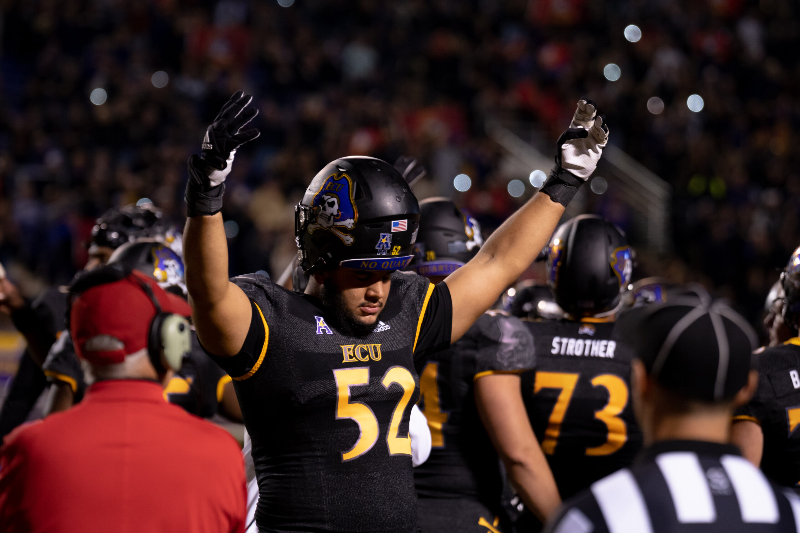 My First ECU College Football Photography Assignment 101 ECU player No. 54 raising his arms to pump up the crowd