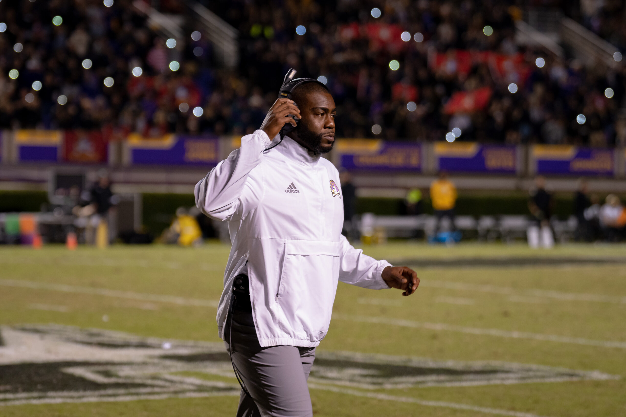 My First ECU College Football Photography Assignment 211 ECU coach in a white jacket walking the sideline