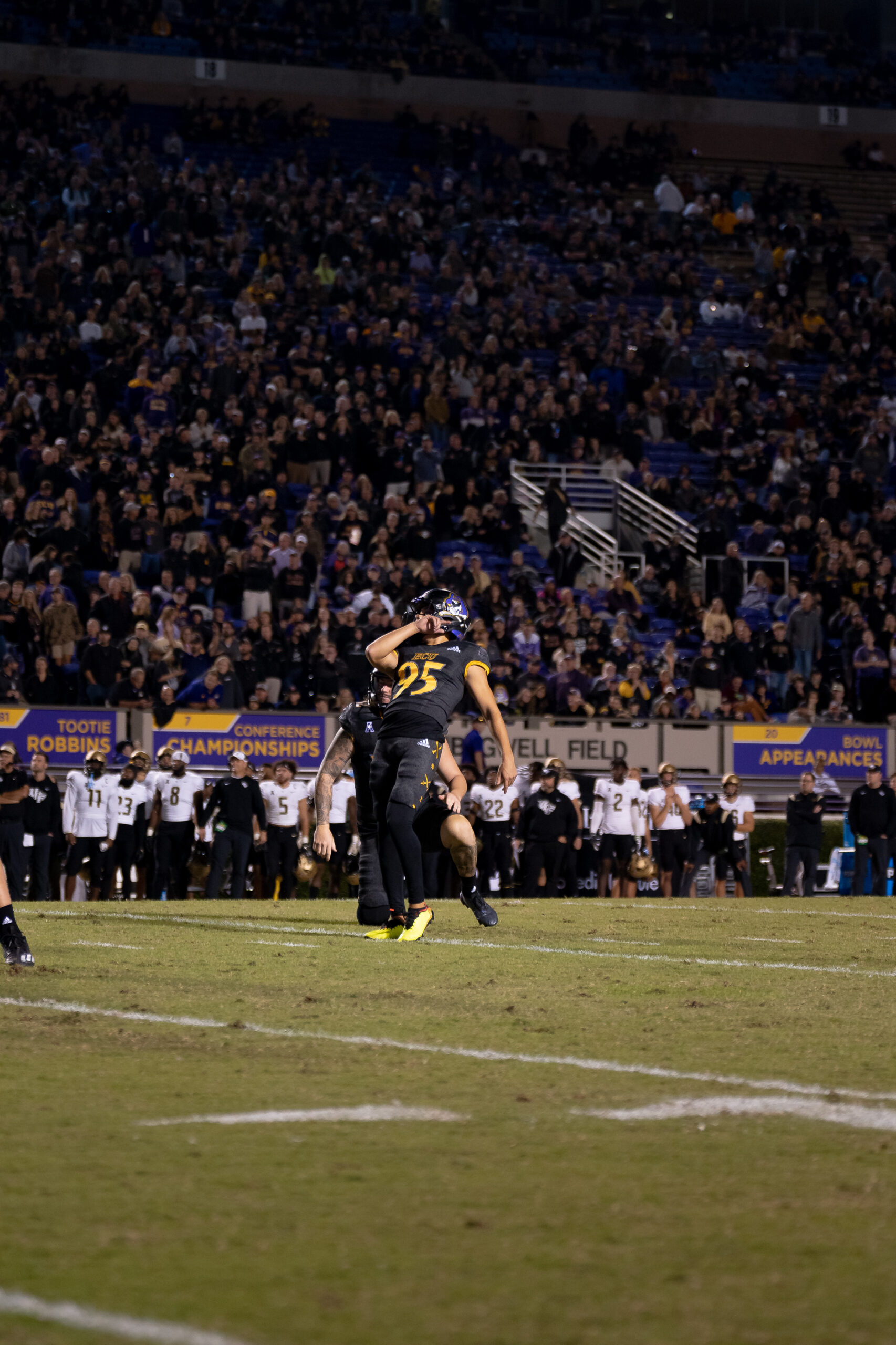My First ECU College Football Photography Assignment 73 Lone ECU player standing on the field with the crowd behind