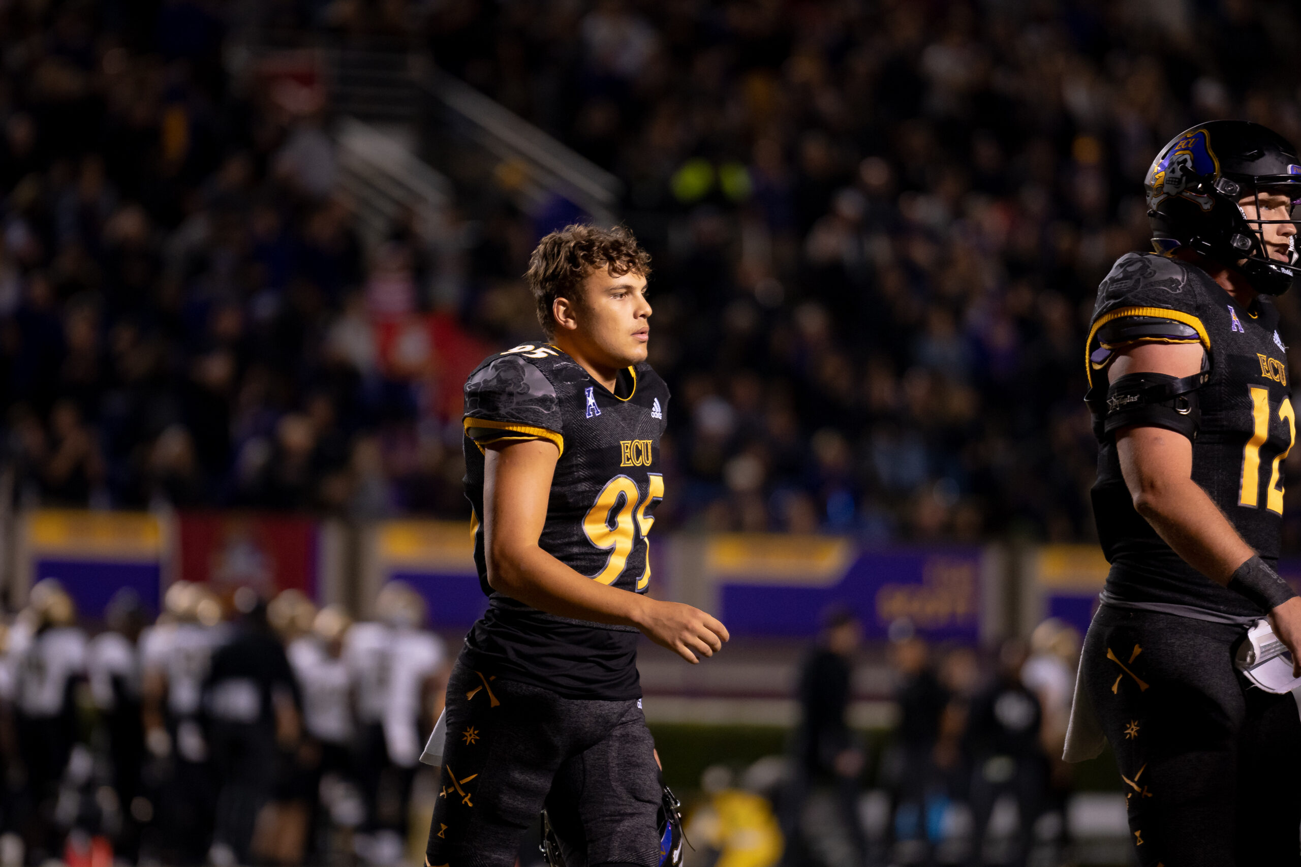 My First ECU College Football Photography Assignment 108 ECU player resting on the sideline during the game