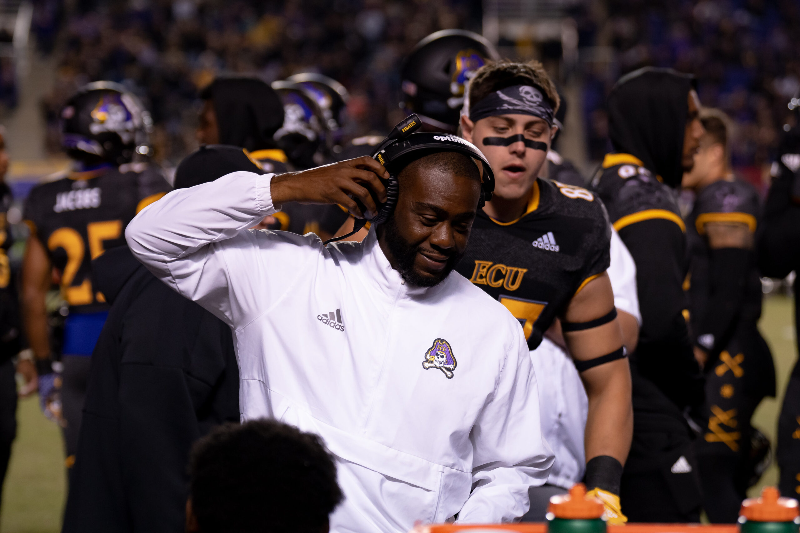 My First ECU College Football Photography Assignment 249 ECU coach in a white polo talking with players
