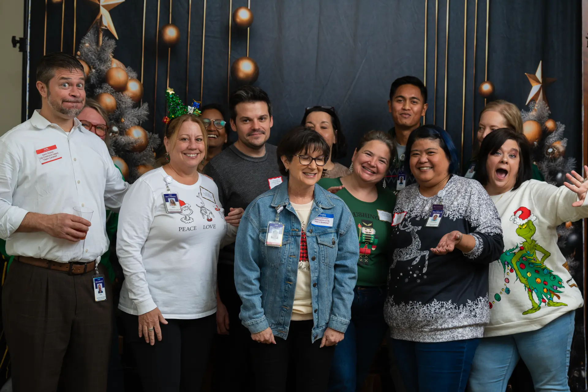 Large group of coworkers posing together at the ECU Health Christmas party