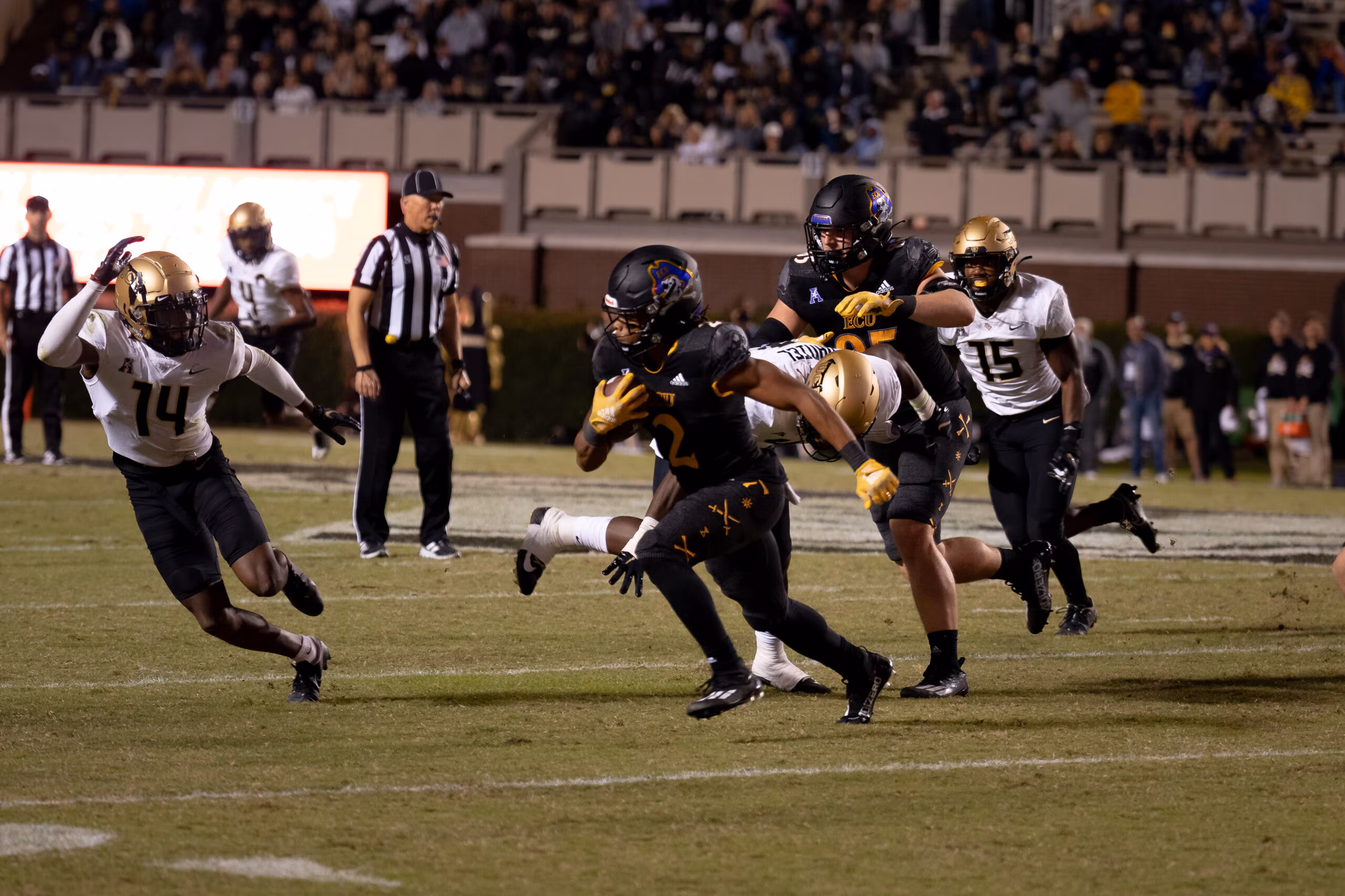 My First ECU College Football Photography Assignment 93 ECU players running a play under the stadium lights