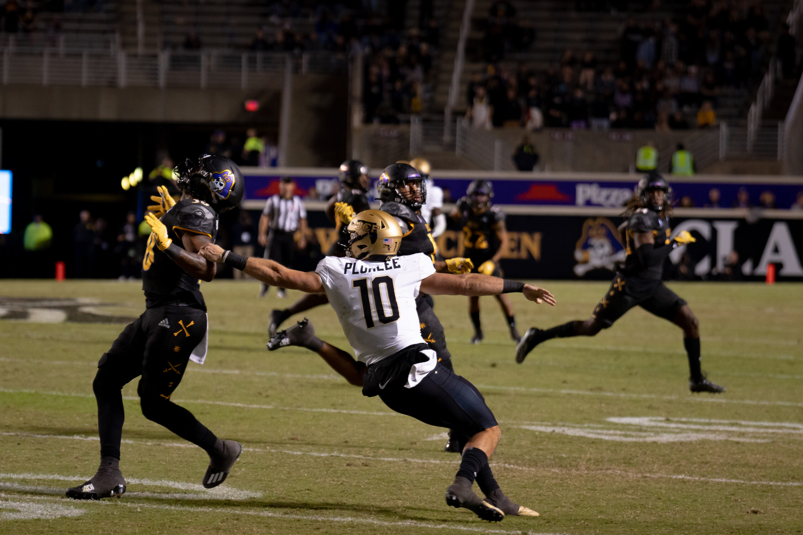 My First ECU College Football Photography Assignment 56 Receiver leaping for a pass in front of a defender