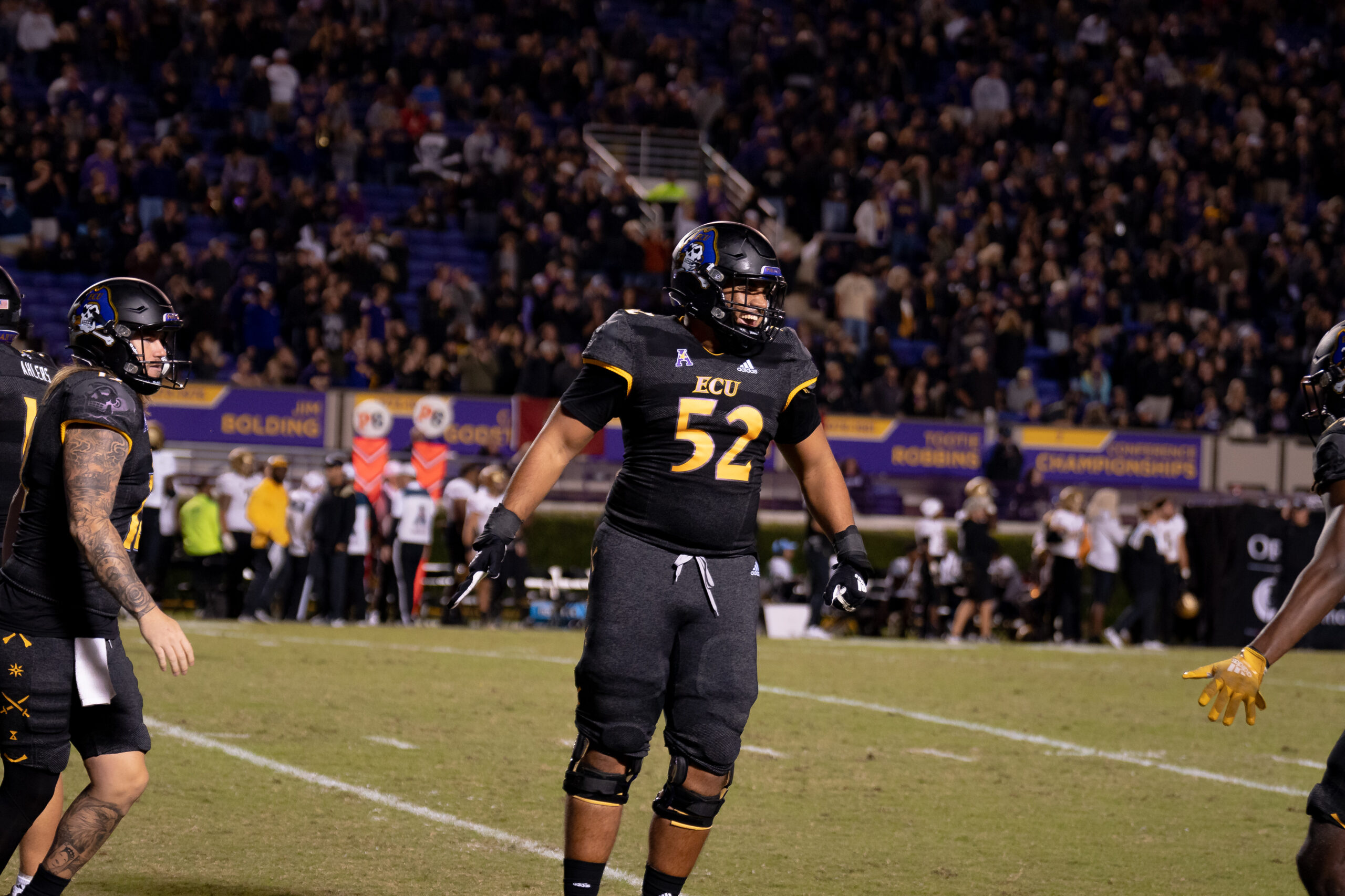 My First ECU College Football Photography Assignment 17 ECU player in a black uniform standing on the field