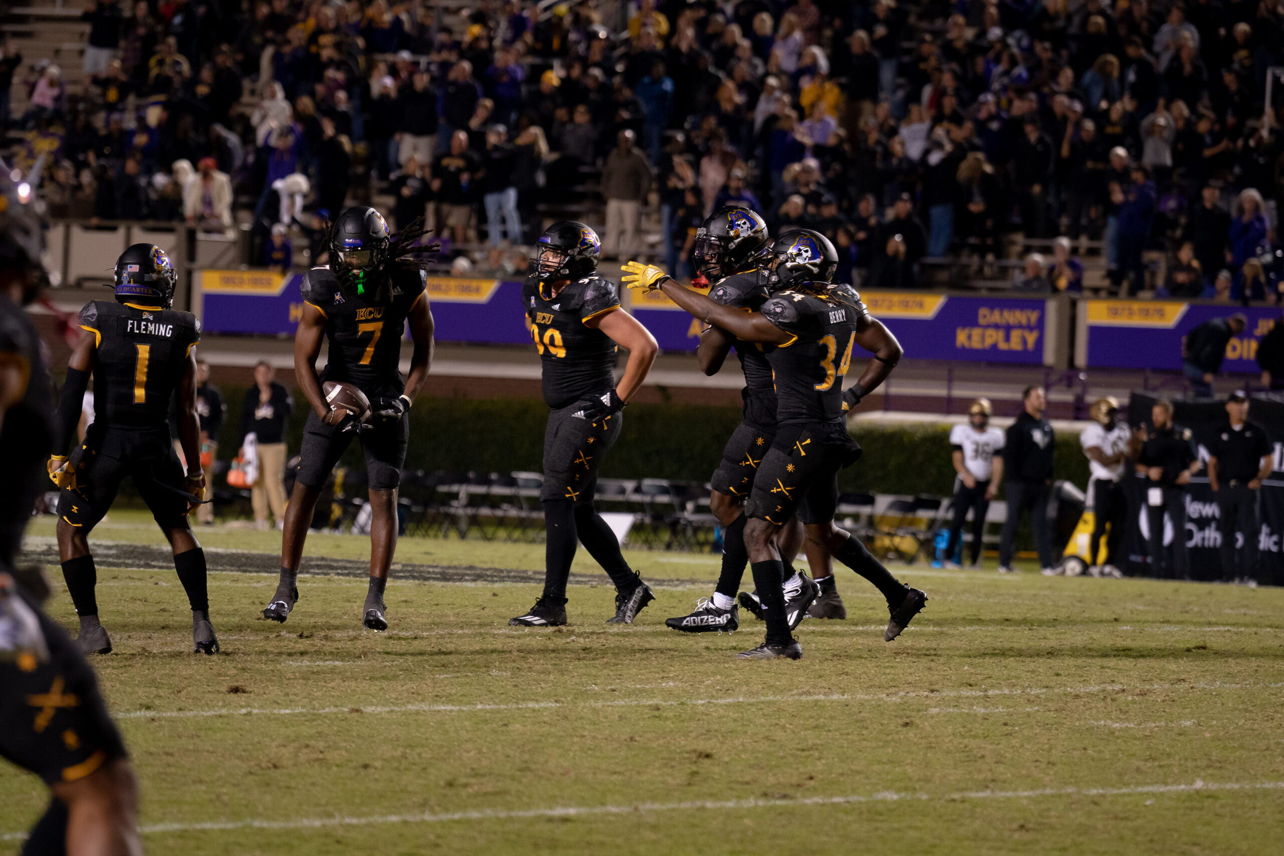 My First ECU College Football Photography Assignment 30 Players battling at the line under the stadium lights