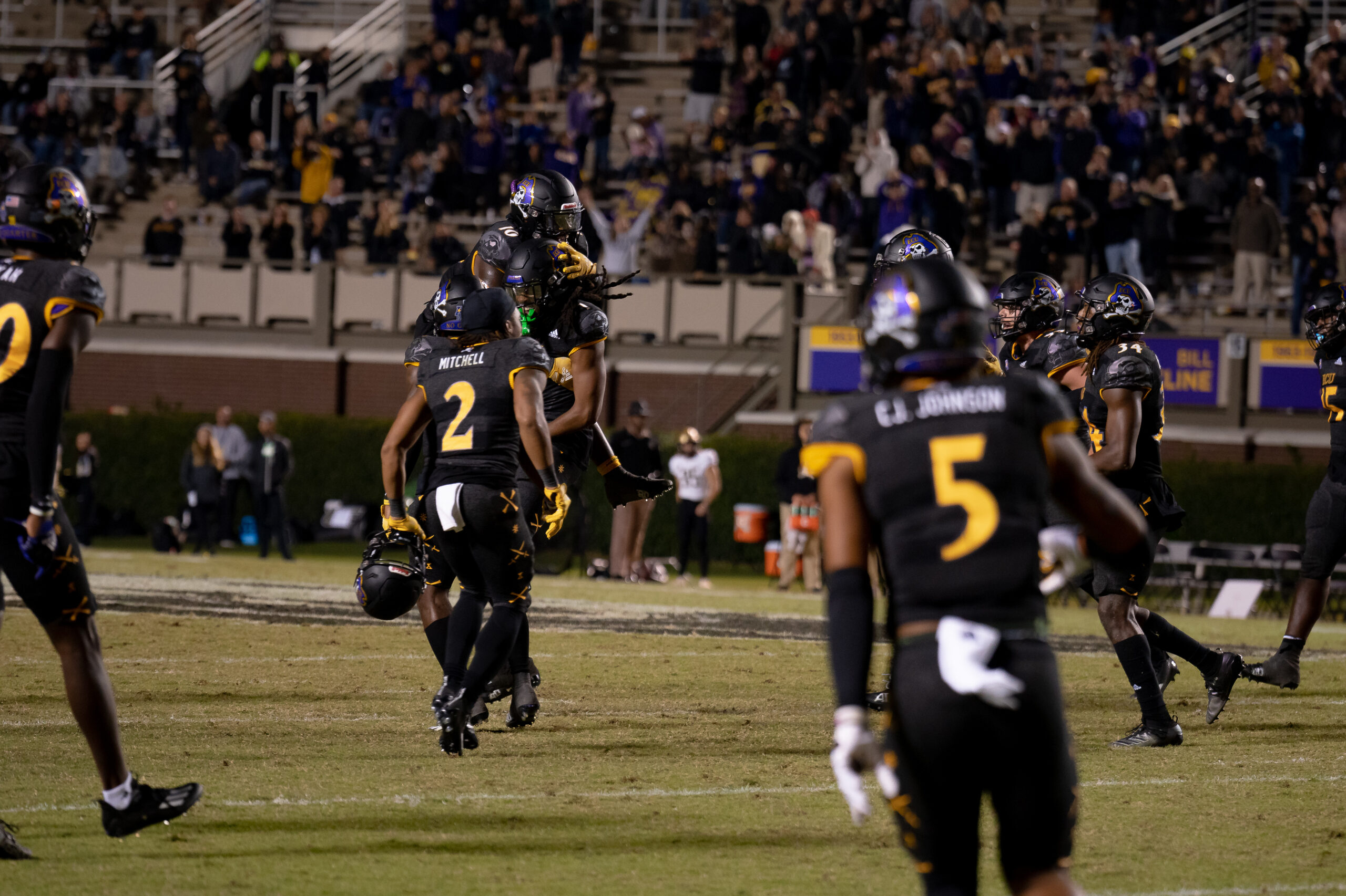 My First ECU College Football Photography Assignment 53 ECU player in a black No. 5 jersey on the field