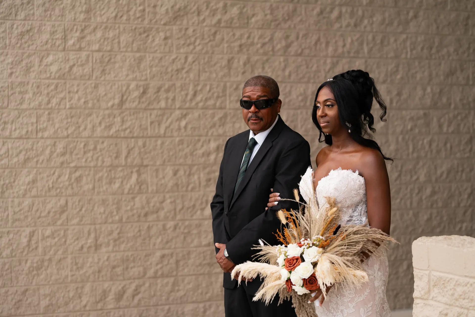 Bride and her father walk toward the ceremony
