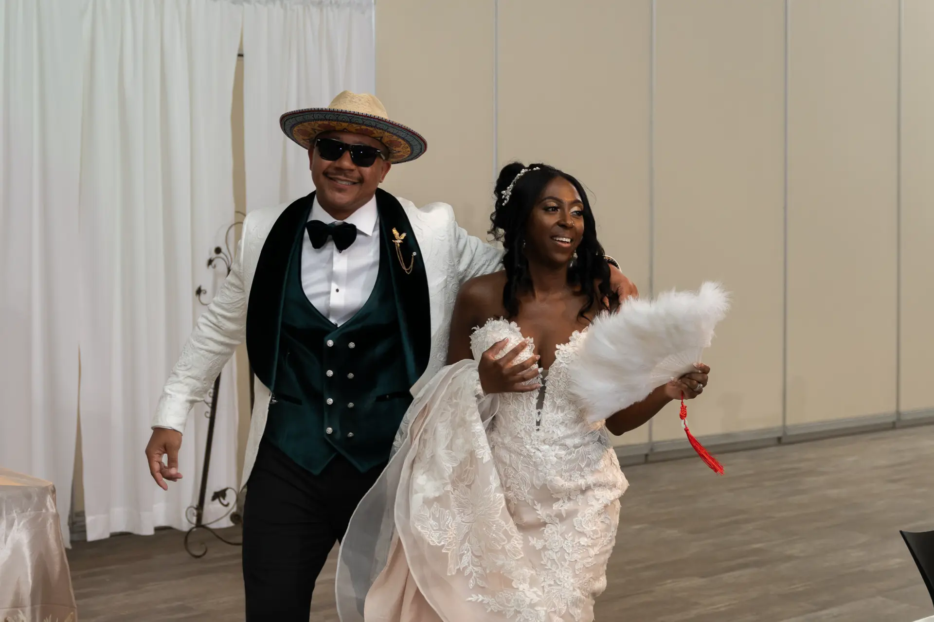 Groom in a western hat and bride make their grand entrance